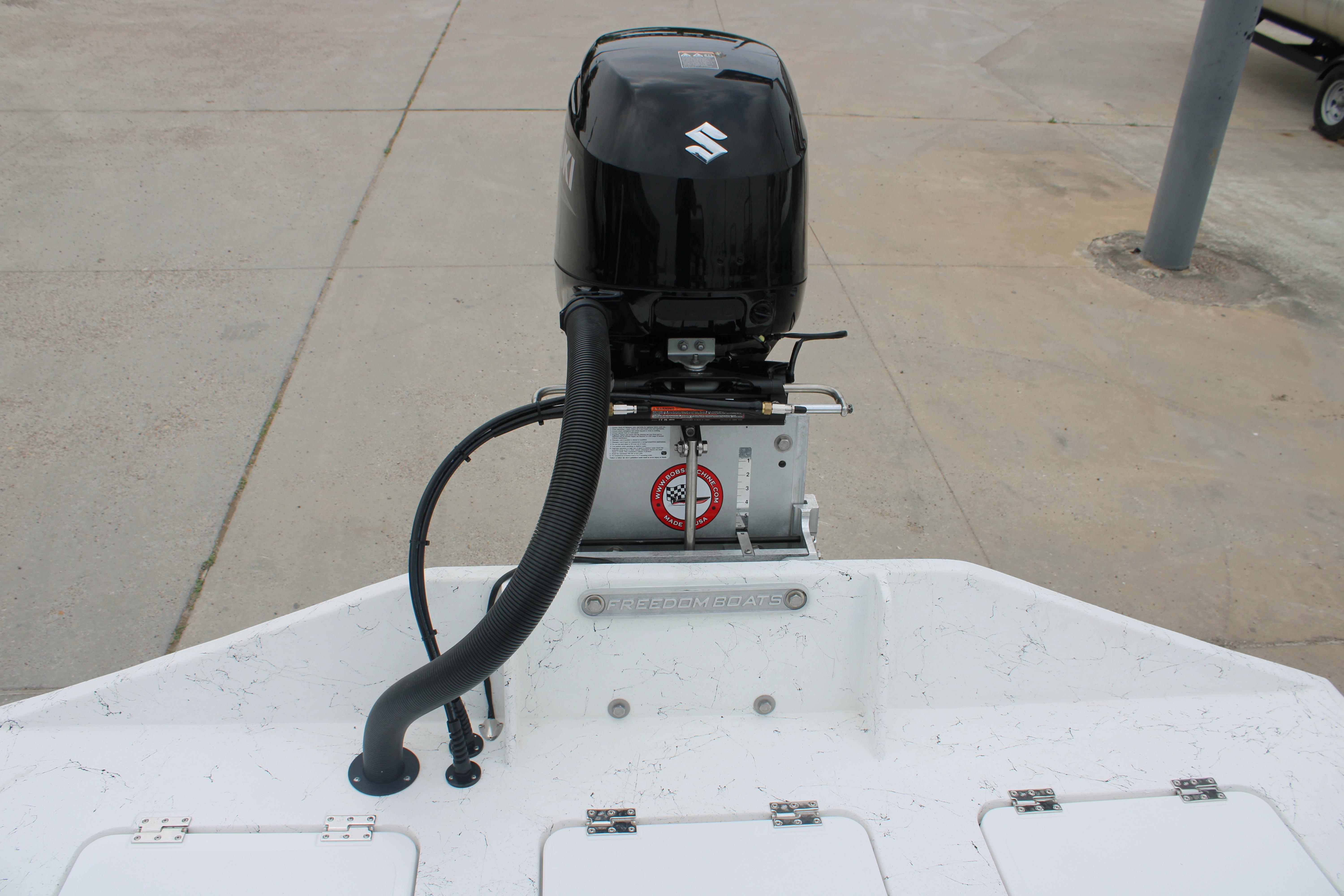 2026 Freedom Boats 16' Eagle with Suzuki outboard motor, rear view.