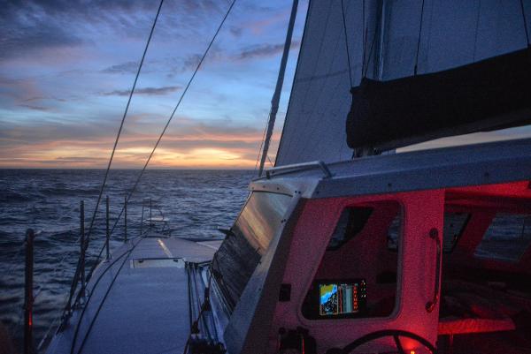 Seawind 1170 sailing at sunset, 2025 model, ocean view.