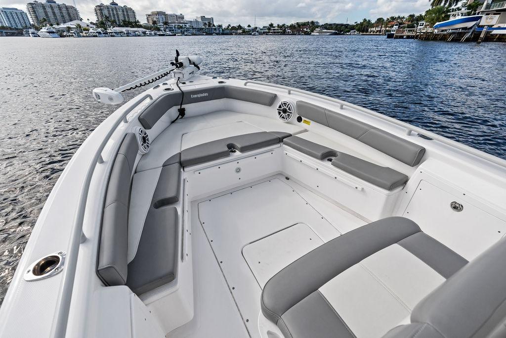 2023 Everglades 243 Center Console boat interior with gray seating on calm water.