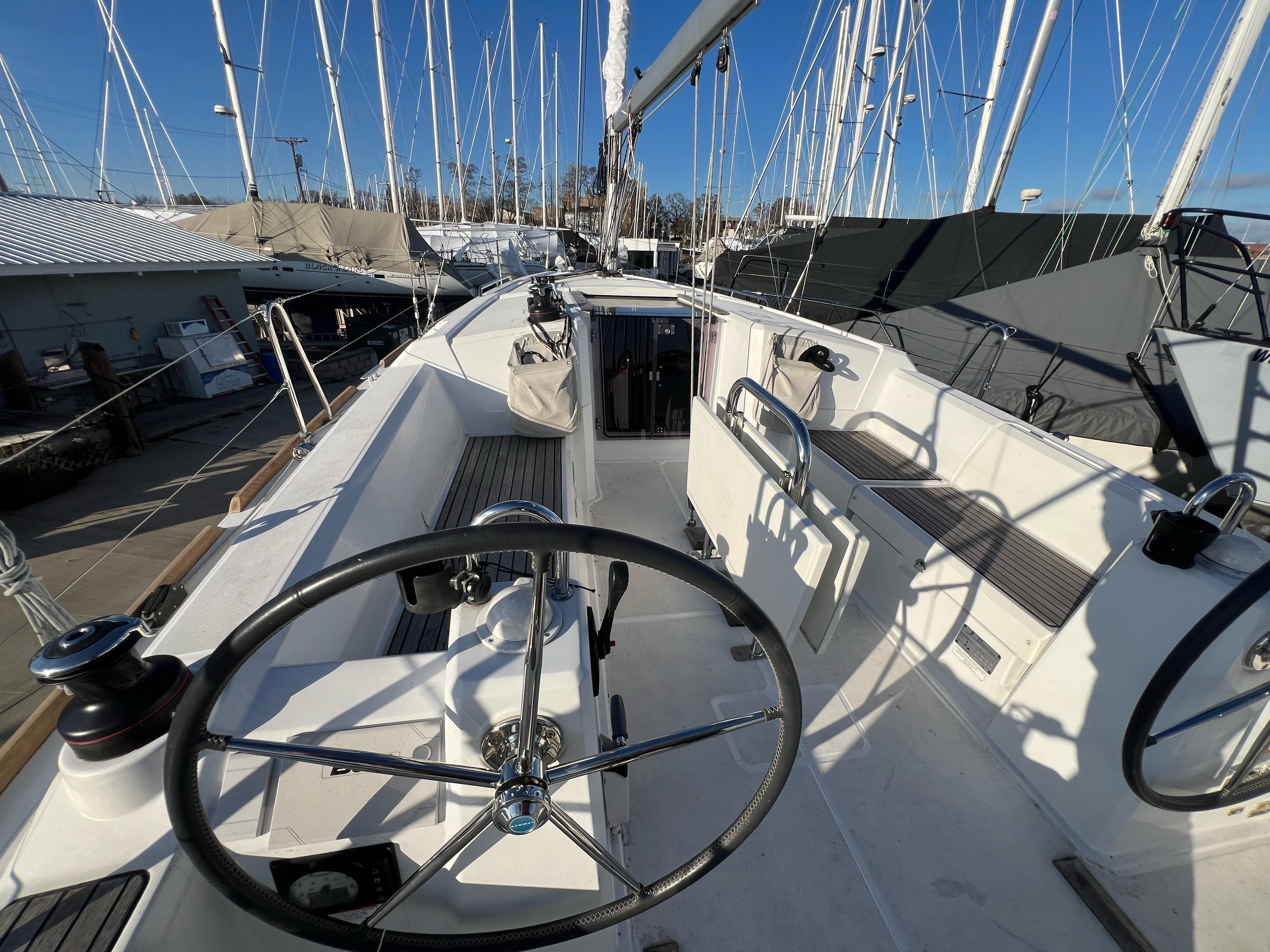 2019 Beneteau Oceanis 35.1 sailboat cockpit with steering wheel and seating.