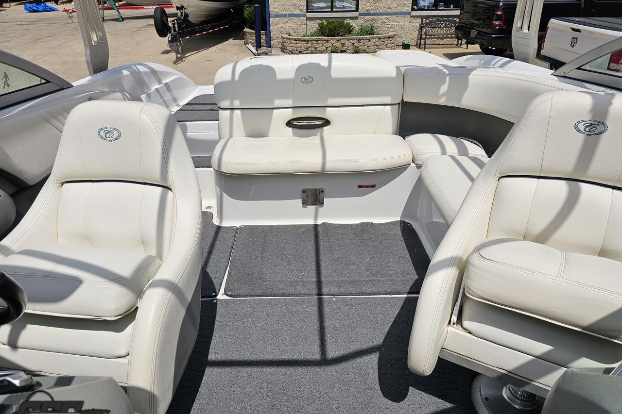 2010 Cobalt 232 WSS boat interior with white seating and gray carpet.