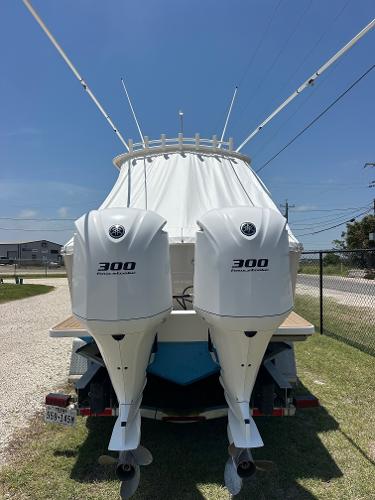2016 Regulator center console boat with twin 300 horsepower engines, parked on a trailer.