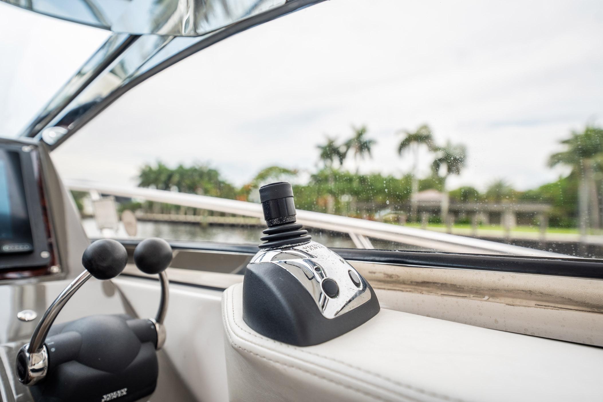Control panel of a 2008 Regal Commodore 4460 yacht with joystick and throttle.
