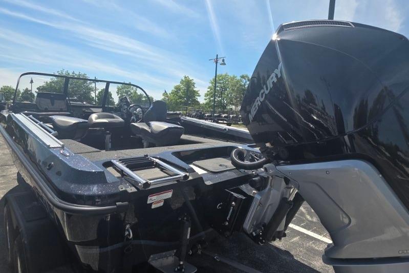 2026 Nitro ZV20 Pro boat with Mercury engine, parked outdoors under clear sky.