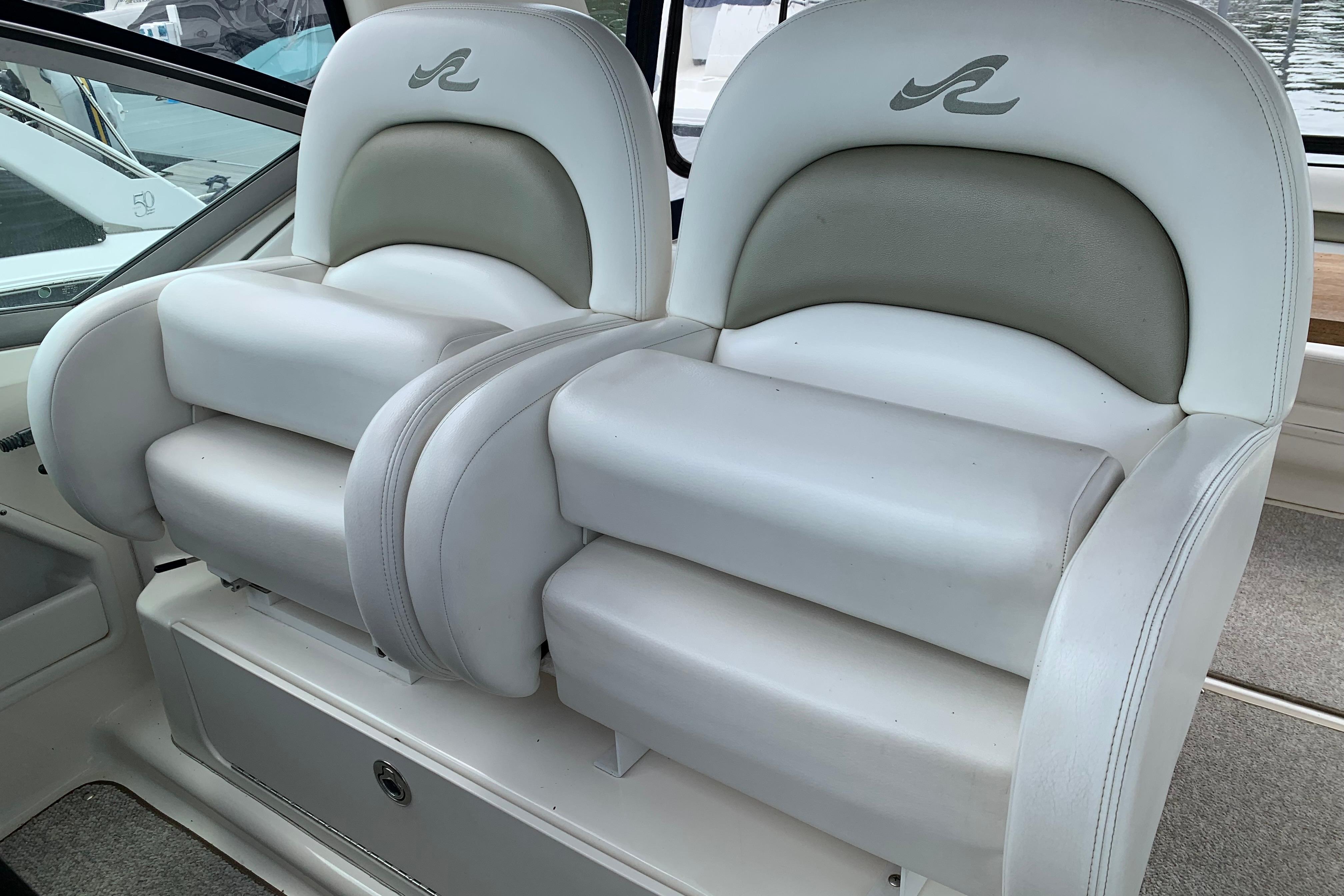 Luxury seating on a 2007 Sea Ray 340 Sundancer boat, featuring plush white upholstery.