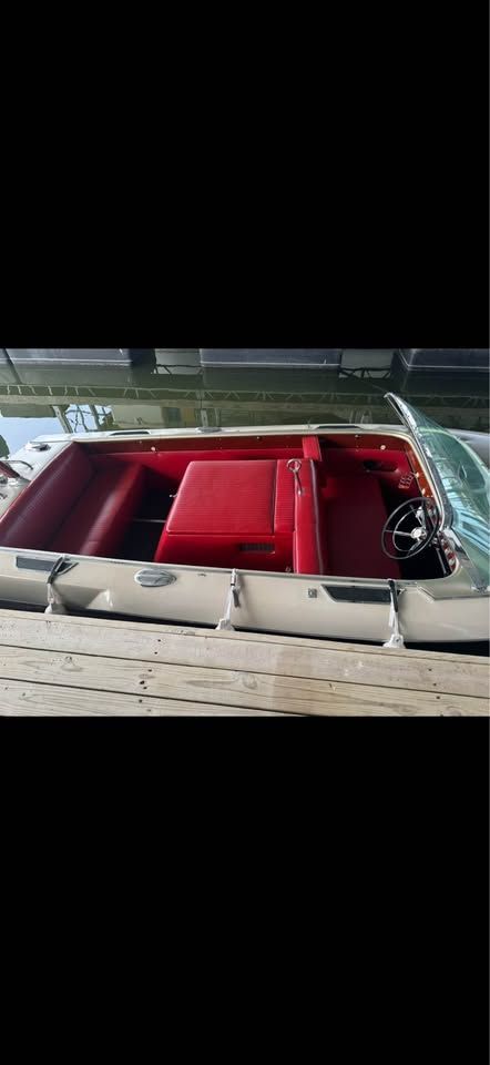 Interior of a 1965 Century Sabre boat with red seats.