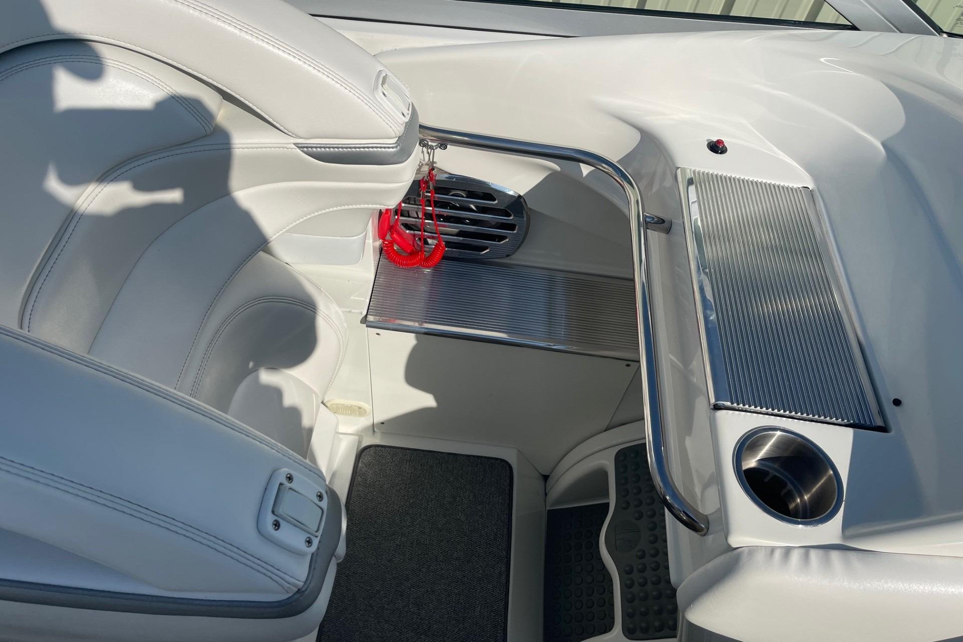 2004 Formula 382 FASTech boat interior with white seating and stainless steel accents.