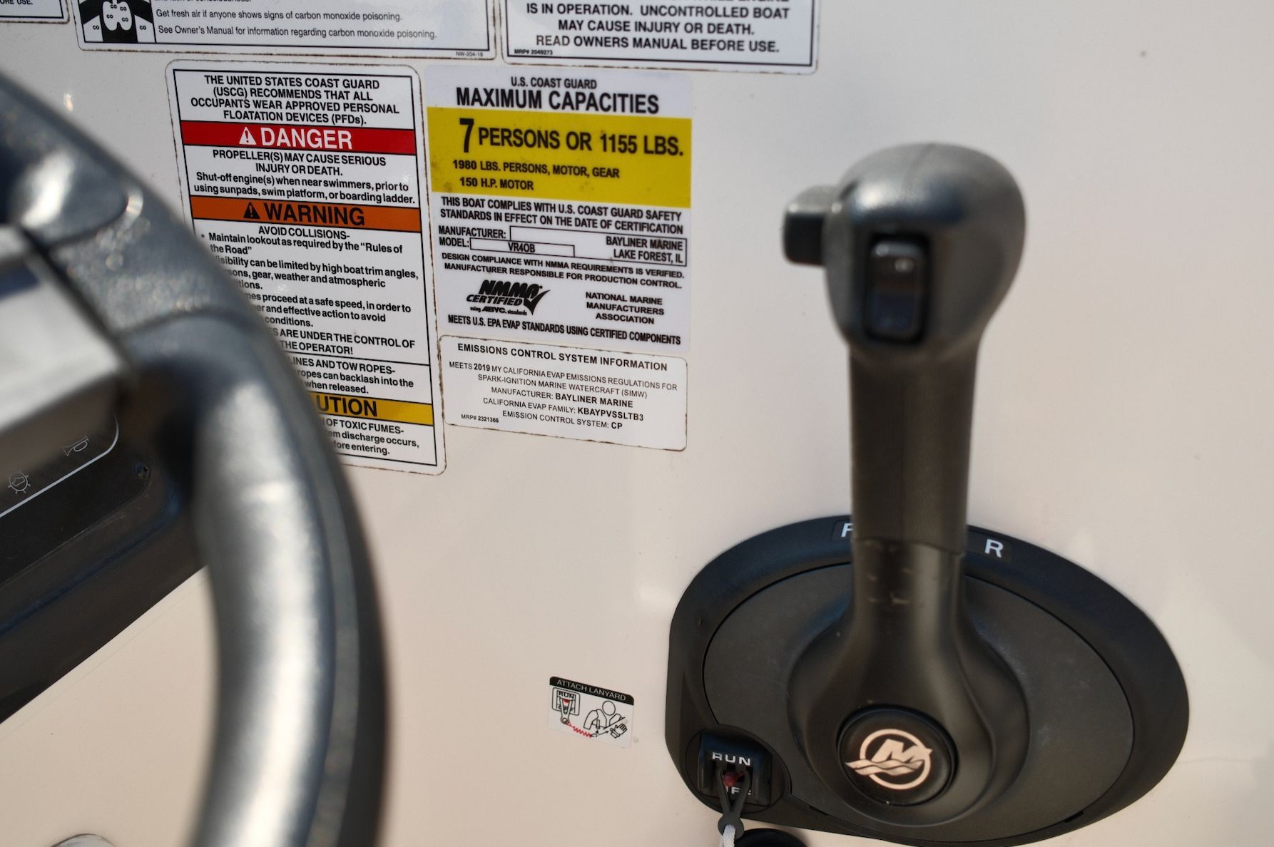 Close-up of the control console with warning labels and capacity information.