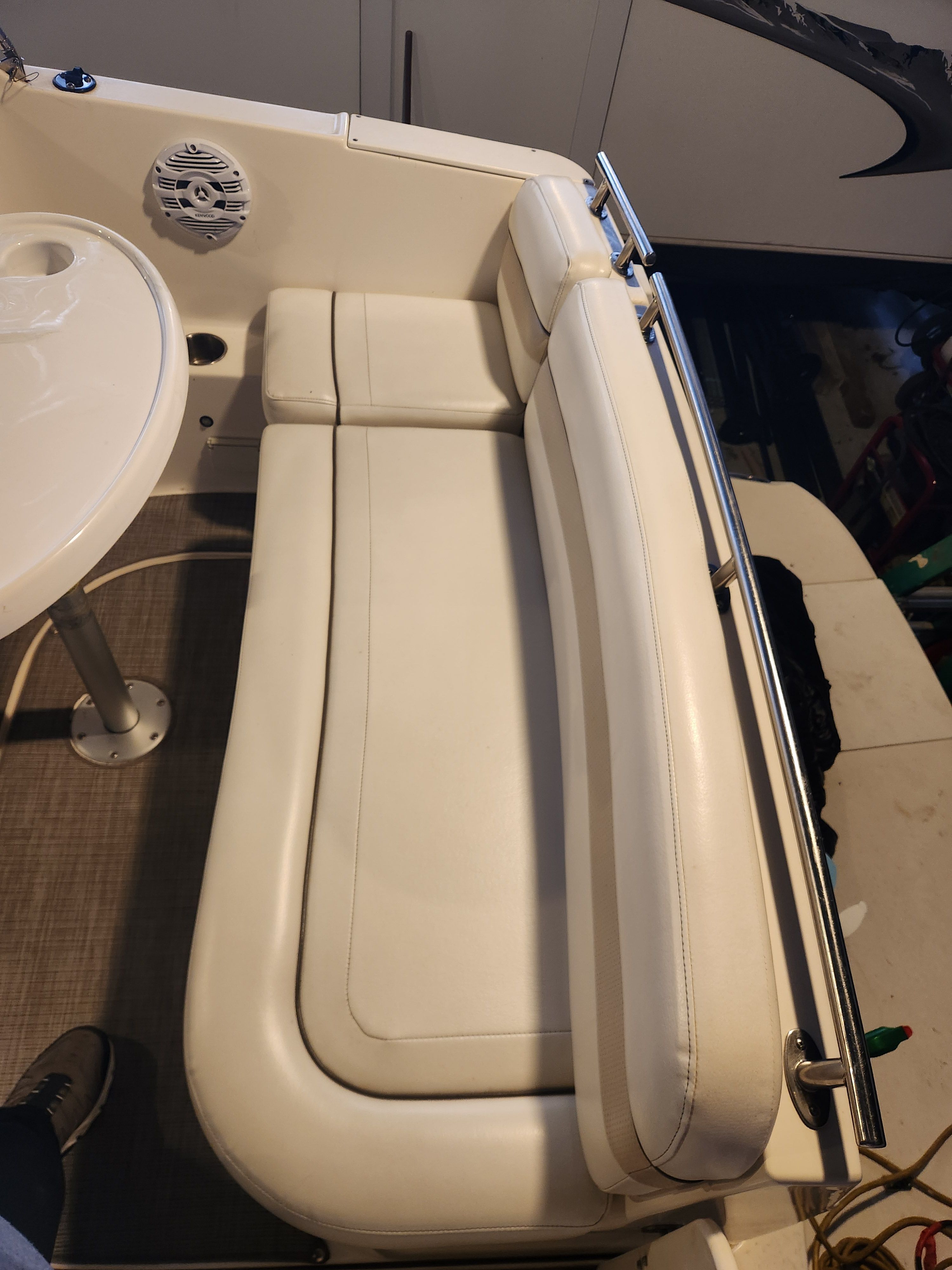 Interior of a 2006 Rinker 250 EC with white seating.