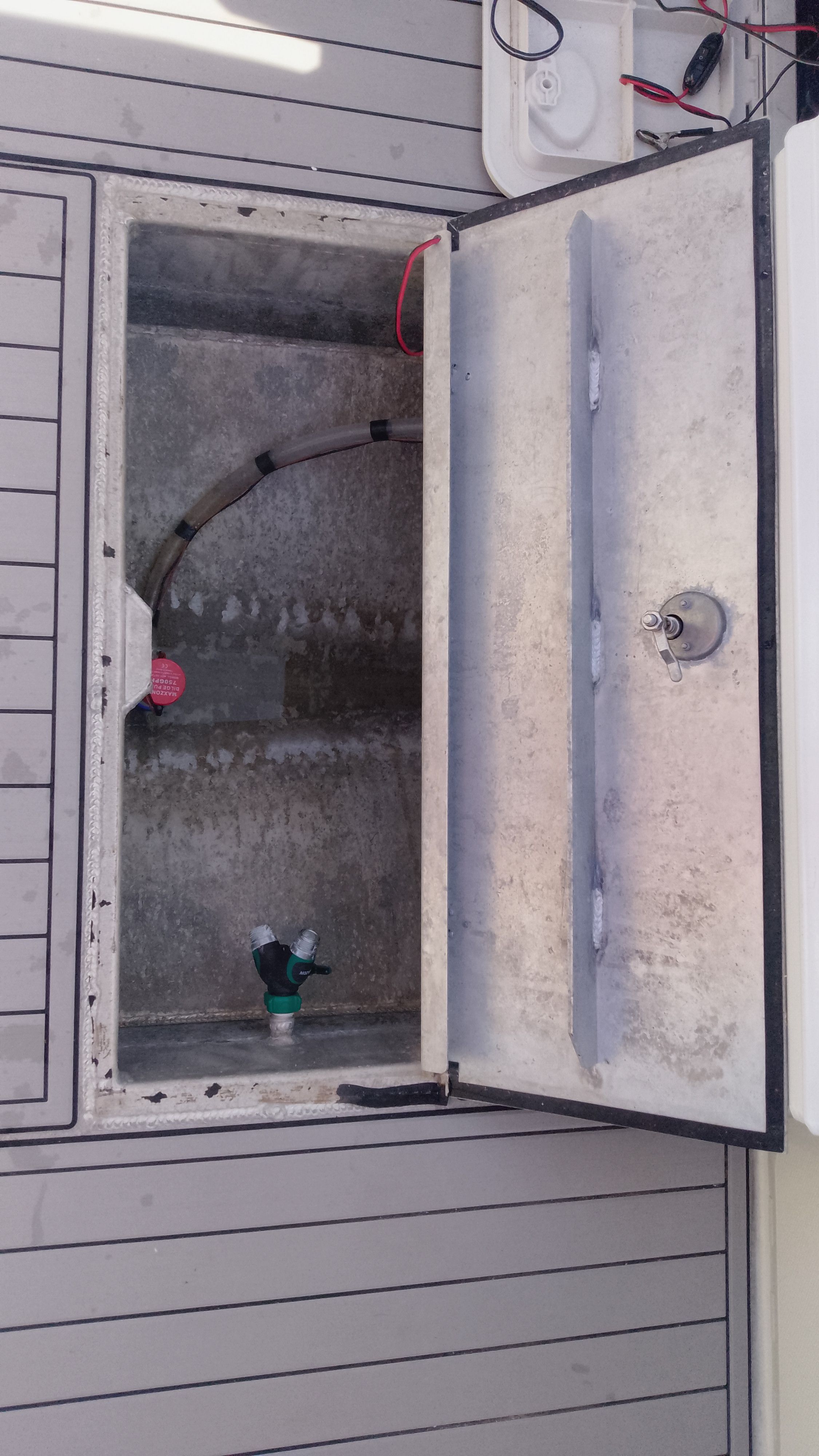 Open storage compartment on a 2024 Gospel Boat 7.5M.