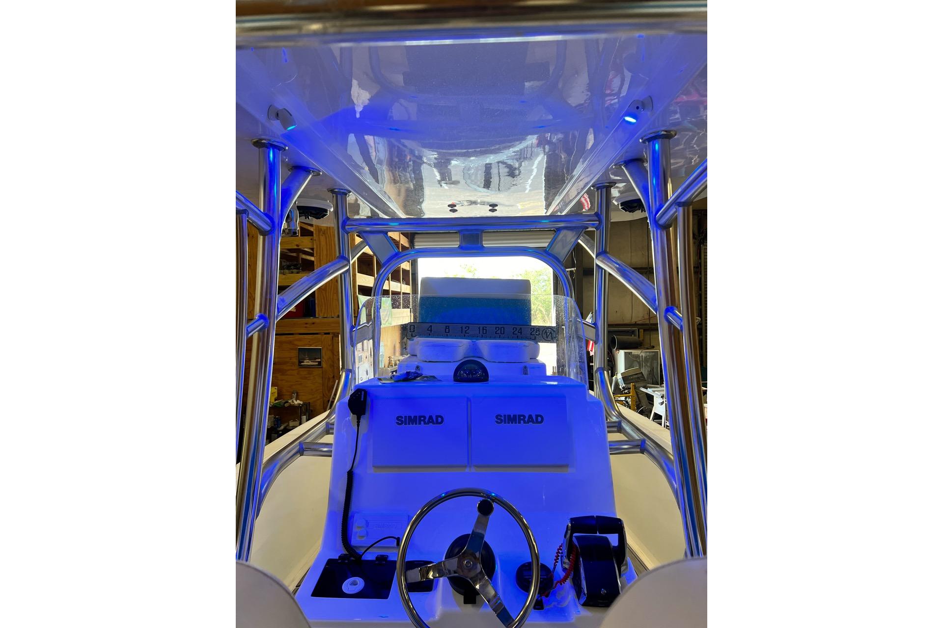 2021 Custom Infusion 34 CC boat interior with Simrad electronics and blue lighting.