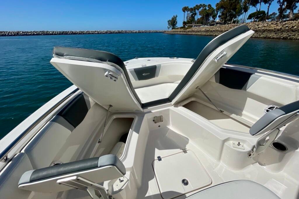 2022 Robalo R230 Center Console boat interior with open storage compartments.