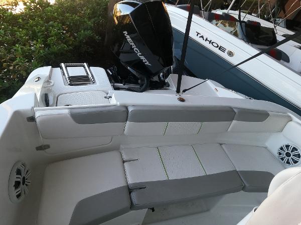 2023 Tahoe 2150 CC boat with Mercury engine, featuring spacious seating and modern design.