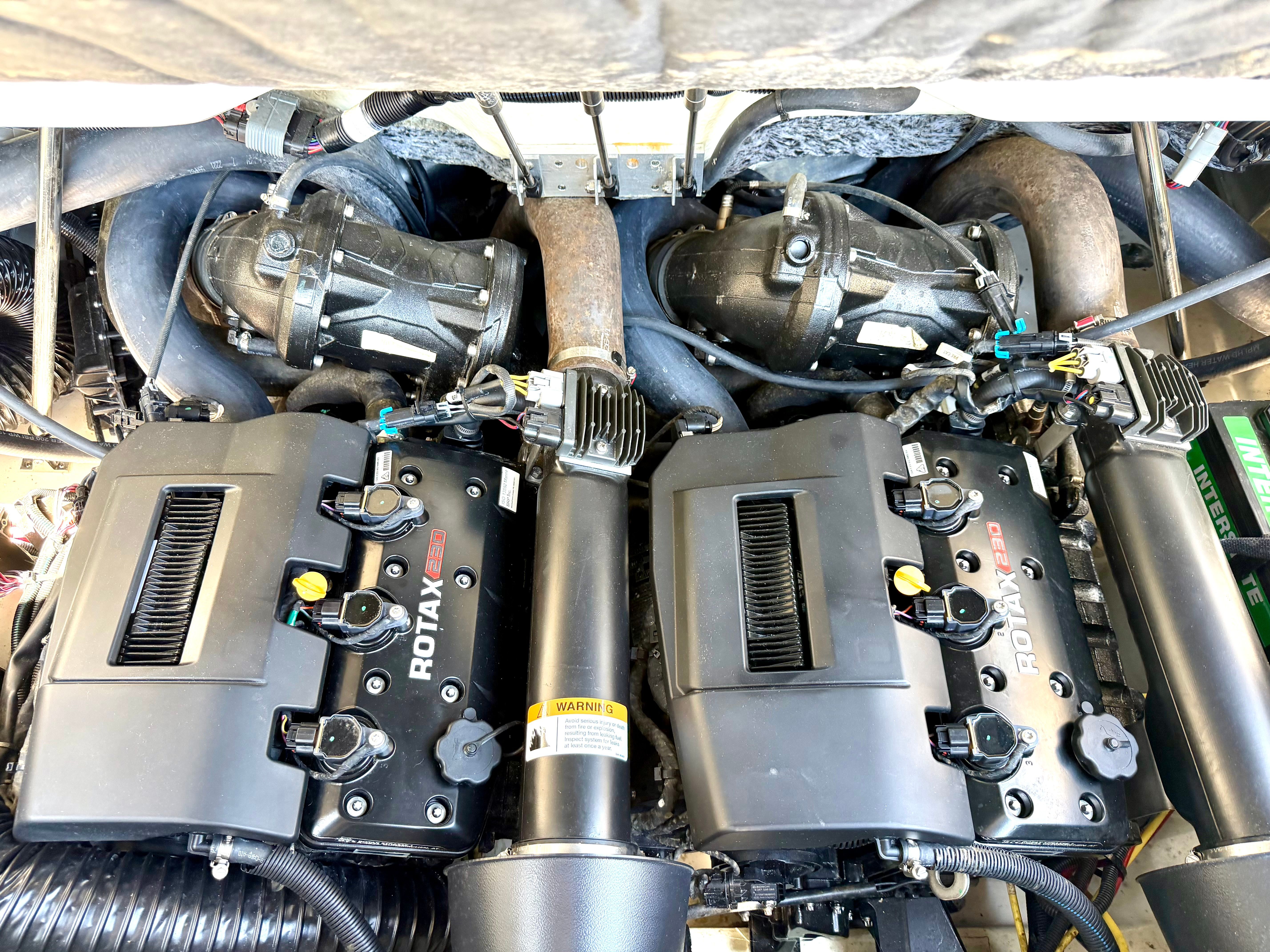 Engine compartment of a Scarab 215 ID boat with two Rotax engines.