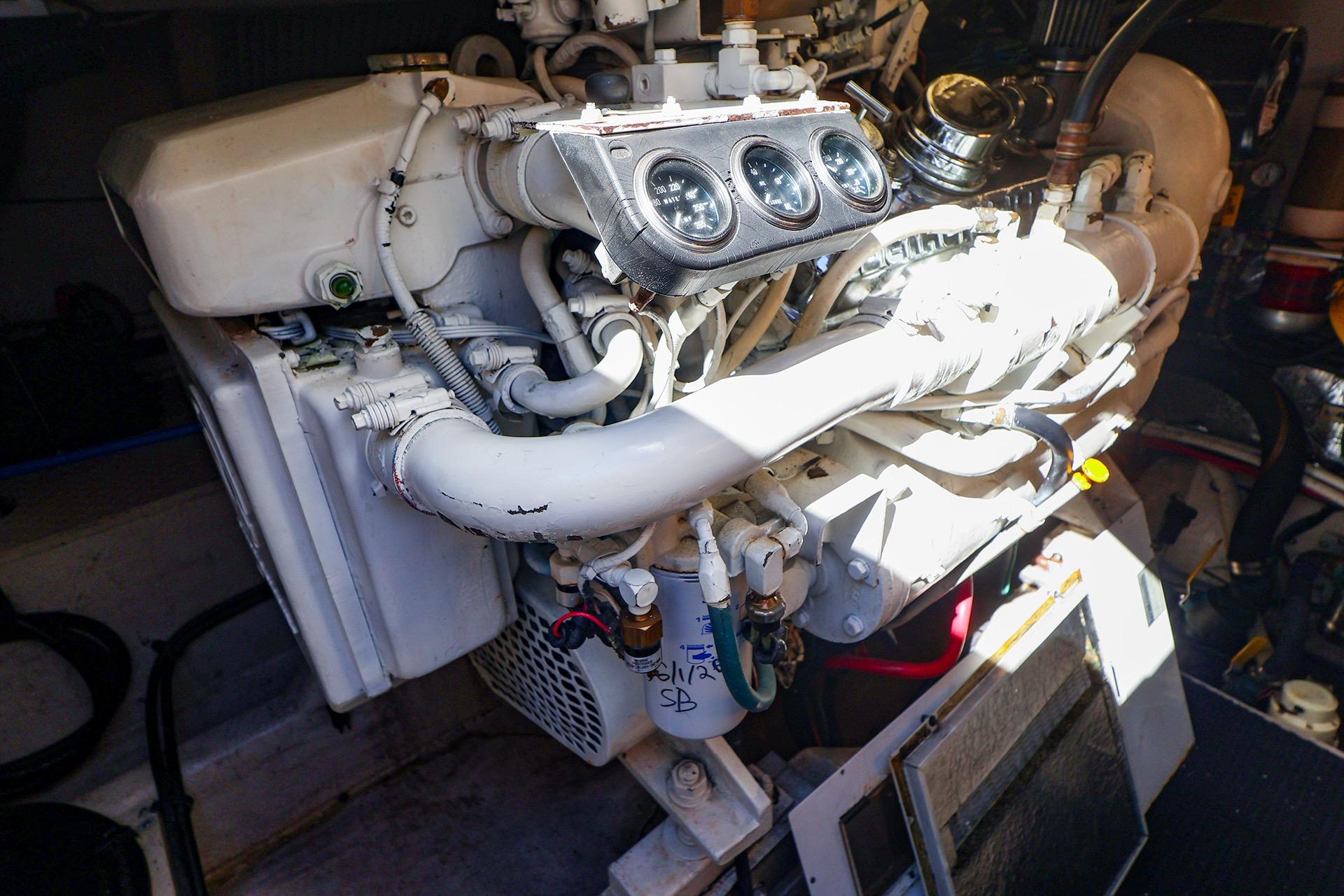 Engine compartment of a 1998 Sea Ray 500 Sundancer boat, showcasing mechanical components.