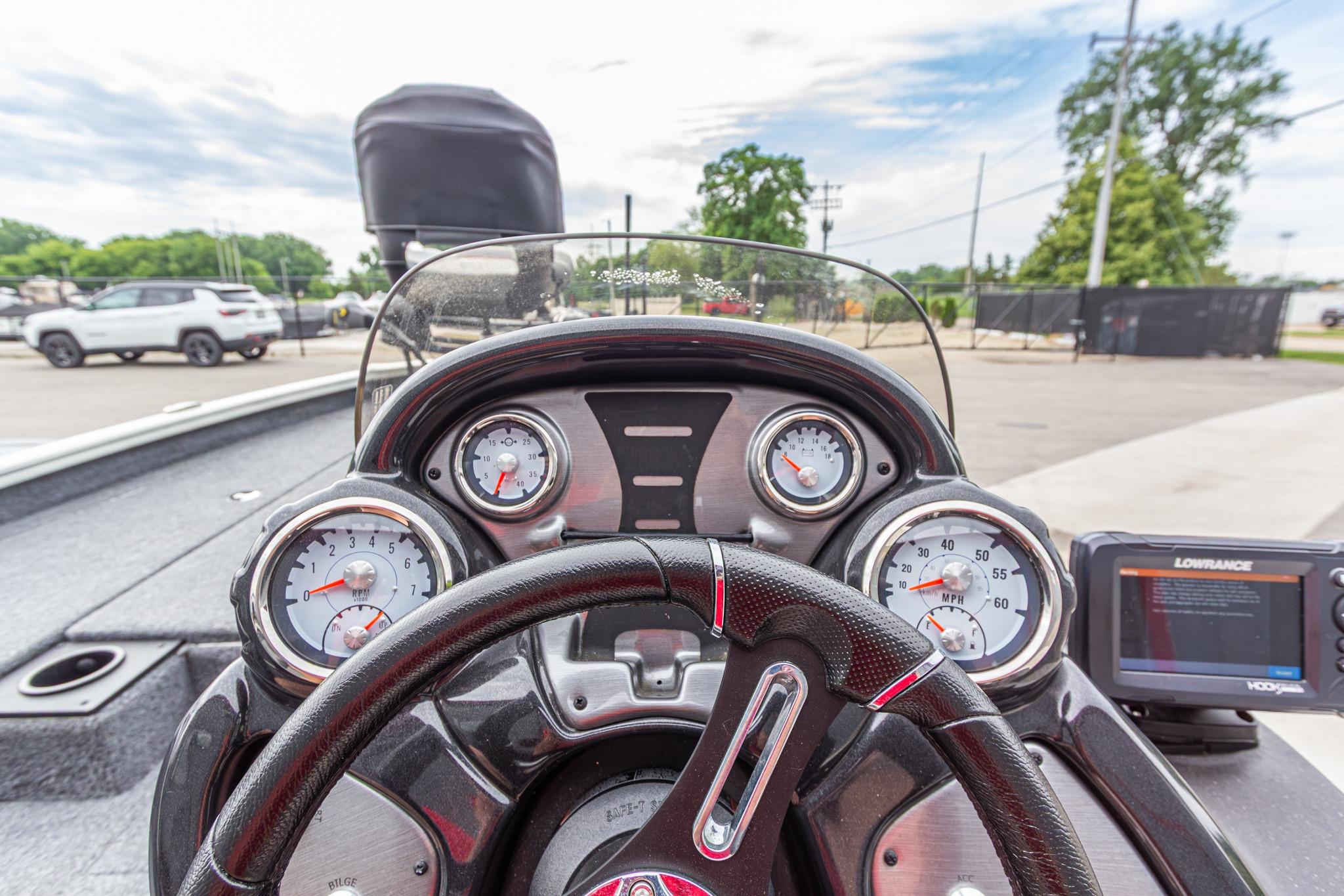 Dashboard of 2023 Tracker Pro Team 190 TX boat with gauges and Lowrance display.