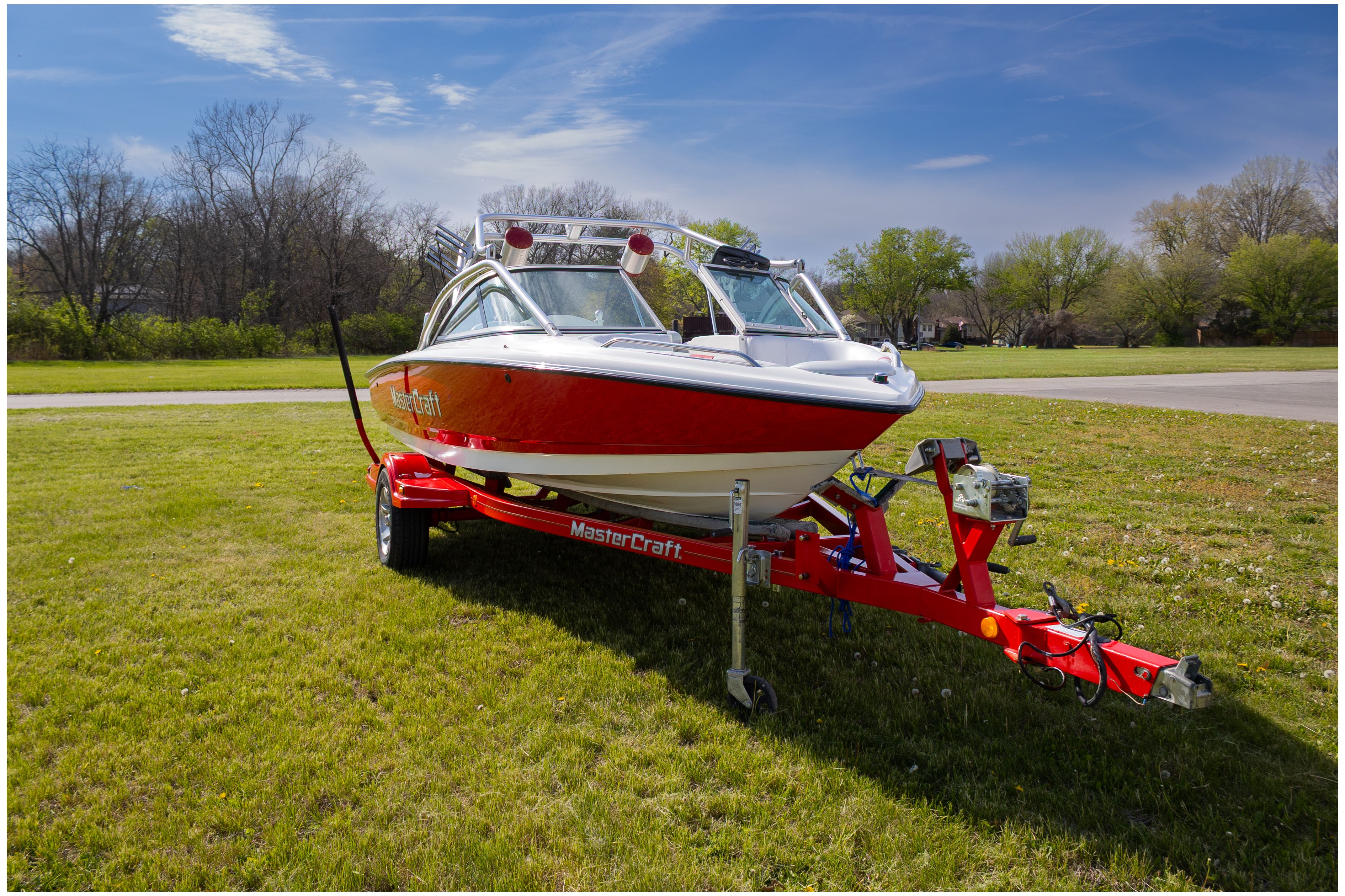 2002 MasterCraft X-7 boat on trailer outdoors.