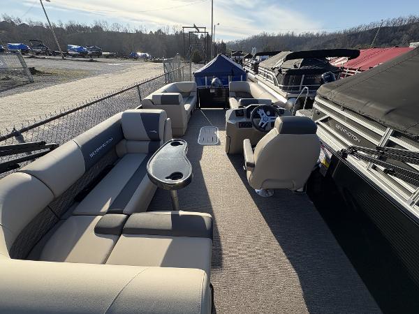 2025 Bennington 23 SL pontoon boat interior with seating and steering console.