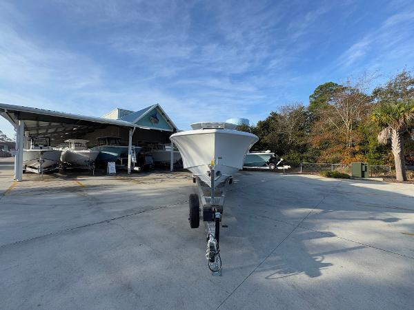 2025 Yellowfin 39 Offshore boat on trailer at marina under clear blue sky.
