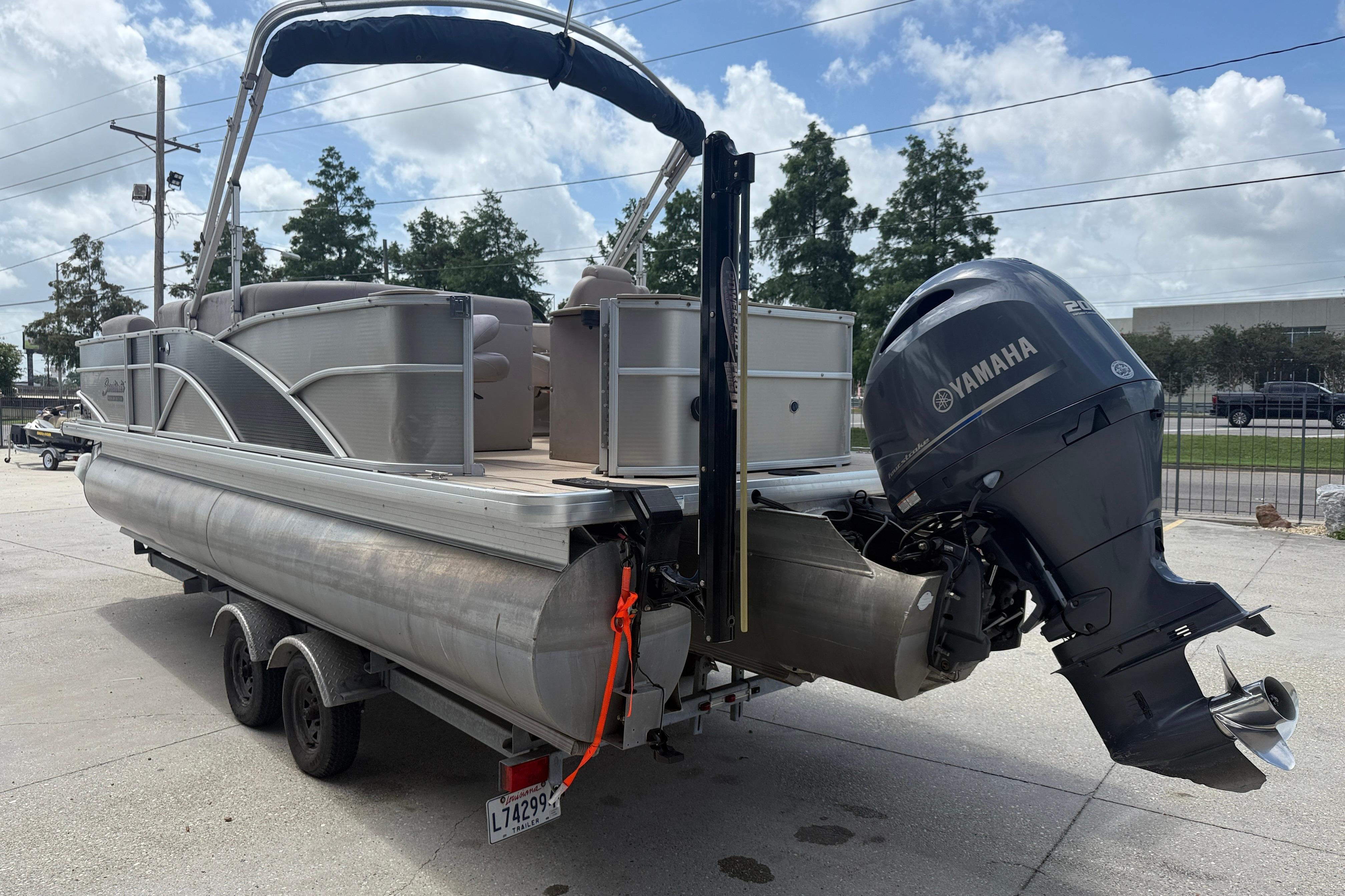 2014 Godfrey Sweetwater 2486 C pontoon boat with Yamaha outboard motor on trailer.