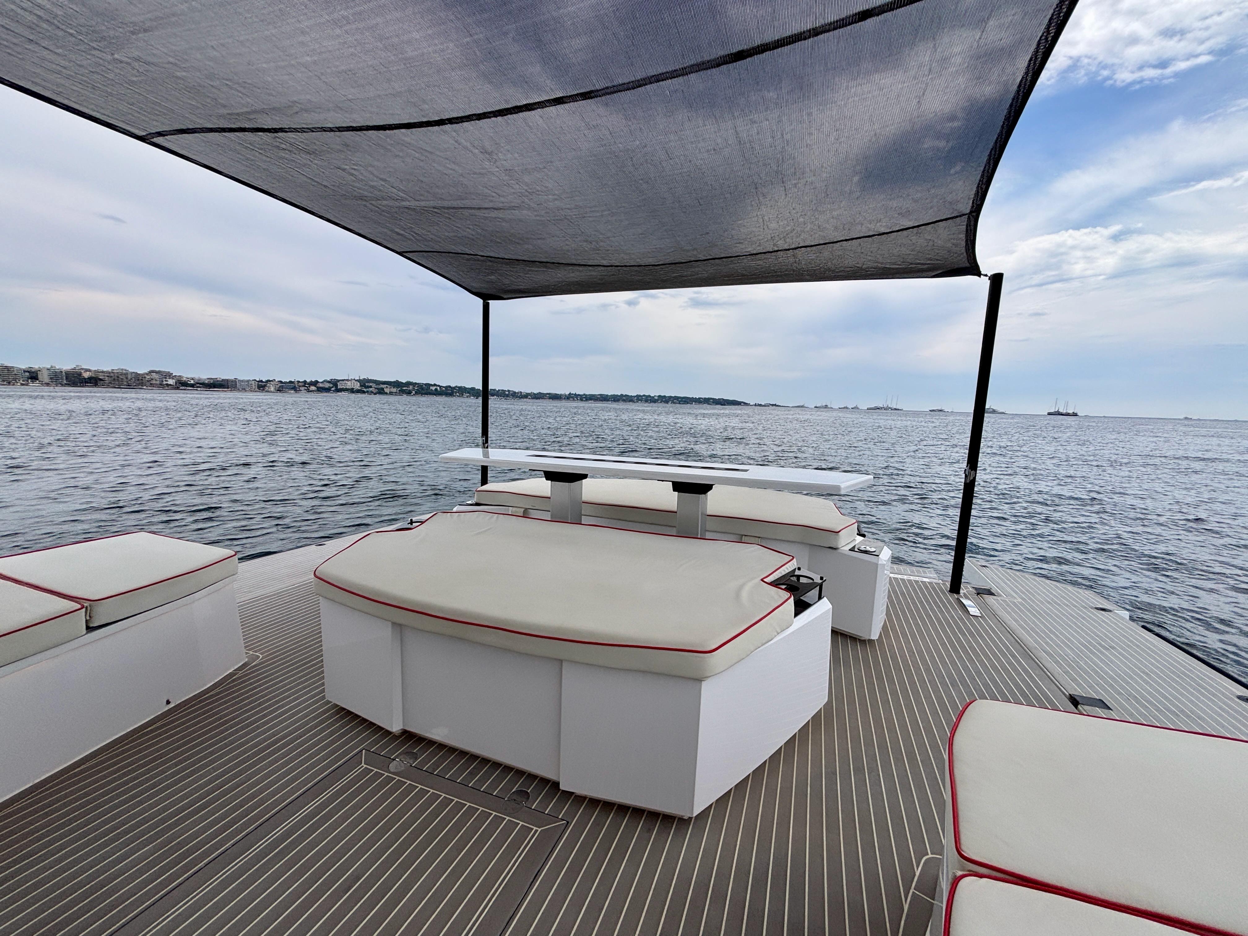 Luxury deck of 2021 OKEAN 55 yacht with seating and ocean view.