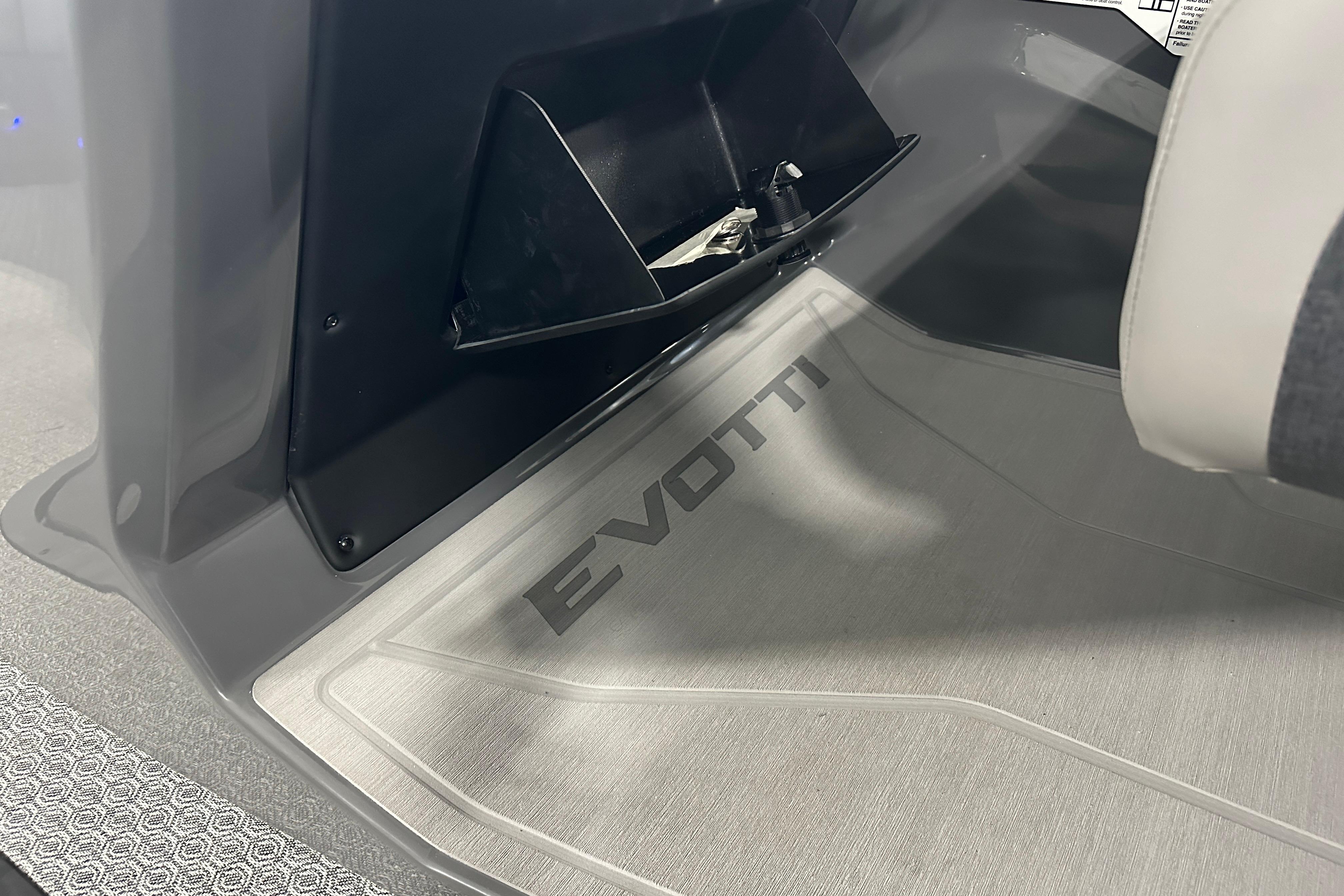 Interior of 2026 Evotti 523QL showcasing branded floor mat and sleek design.