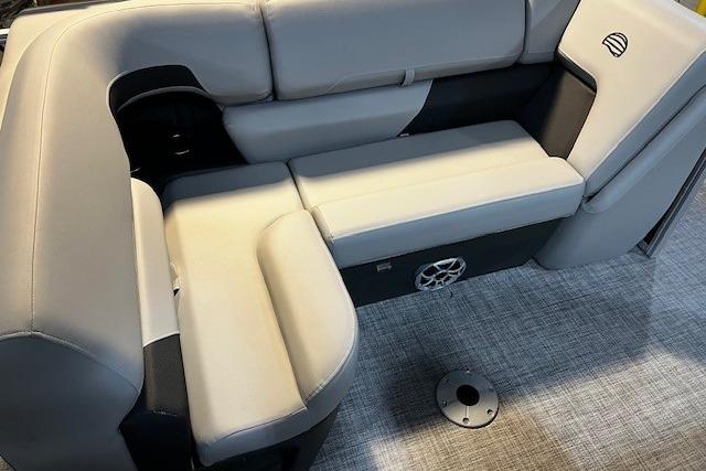 2026 Sun Tracker SportFish 22 DLX boat interior with gray cushioned seating.