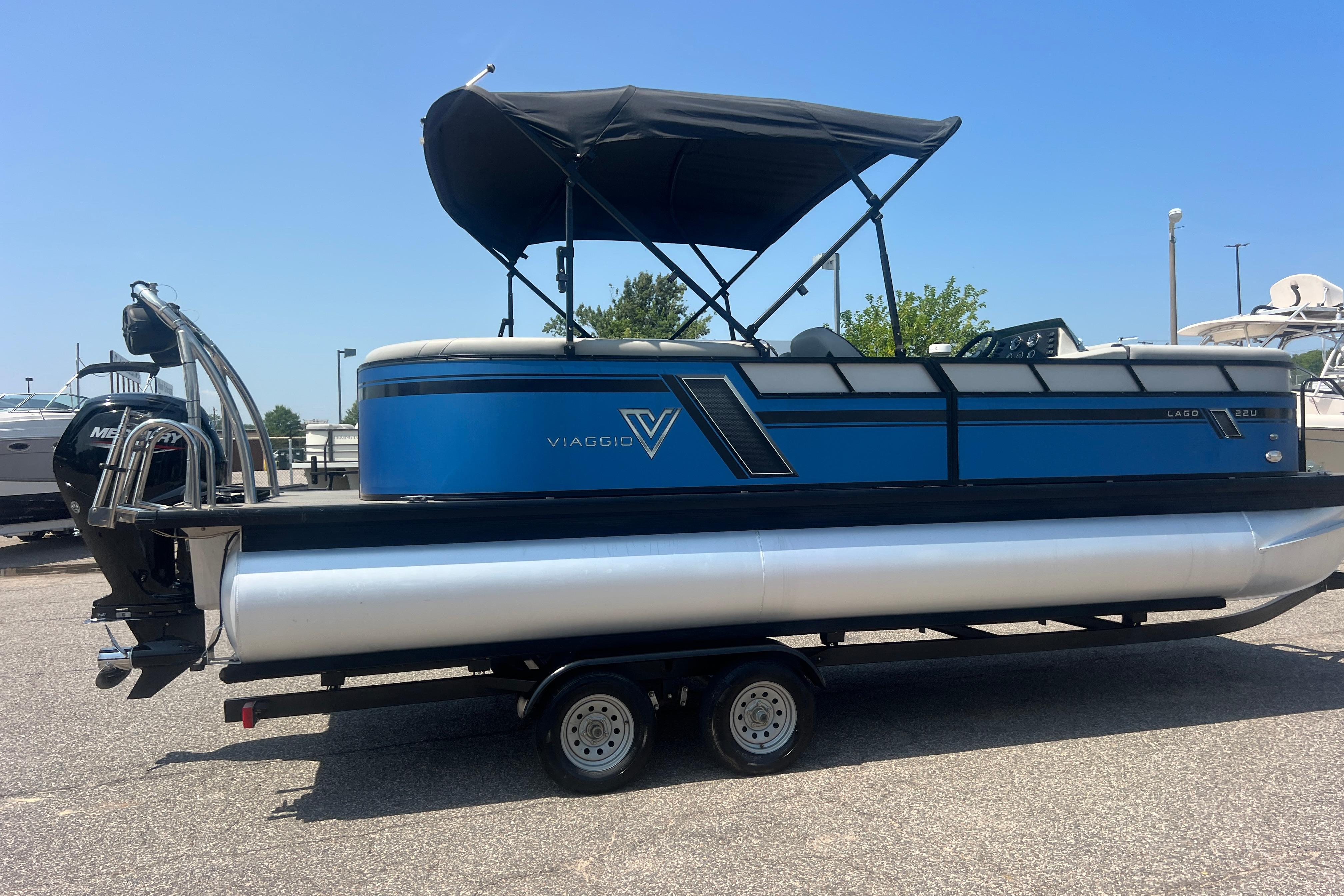 2022 Viaggio Lago V-U 22 pontoon boat with blue exterior on a trailer.