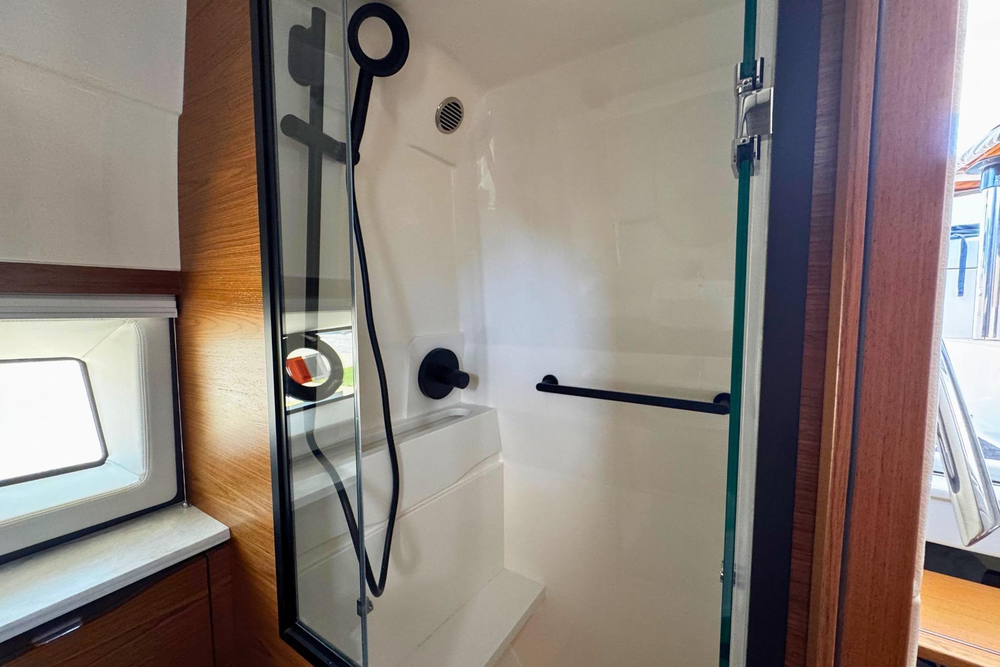 Shower area in 2027 Tiara Yachts 39 LE, featuring modern fixtures and wooden accents.