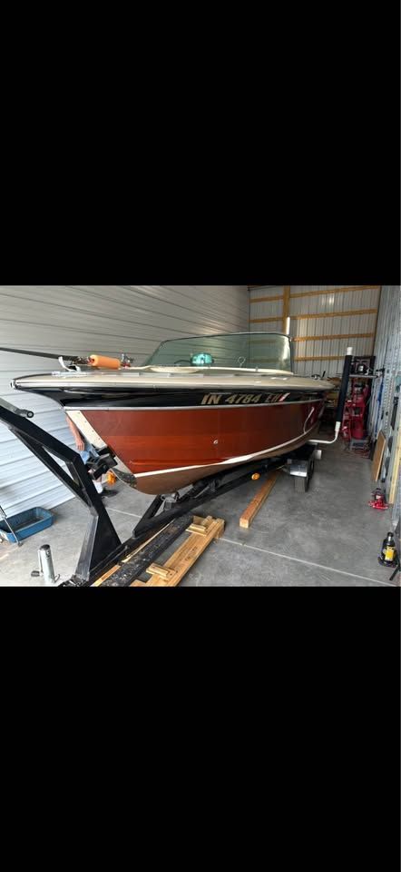 1965 Century Sabre boat in storage on trailer.
