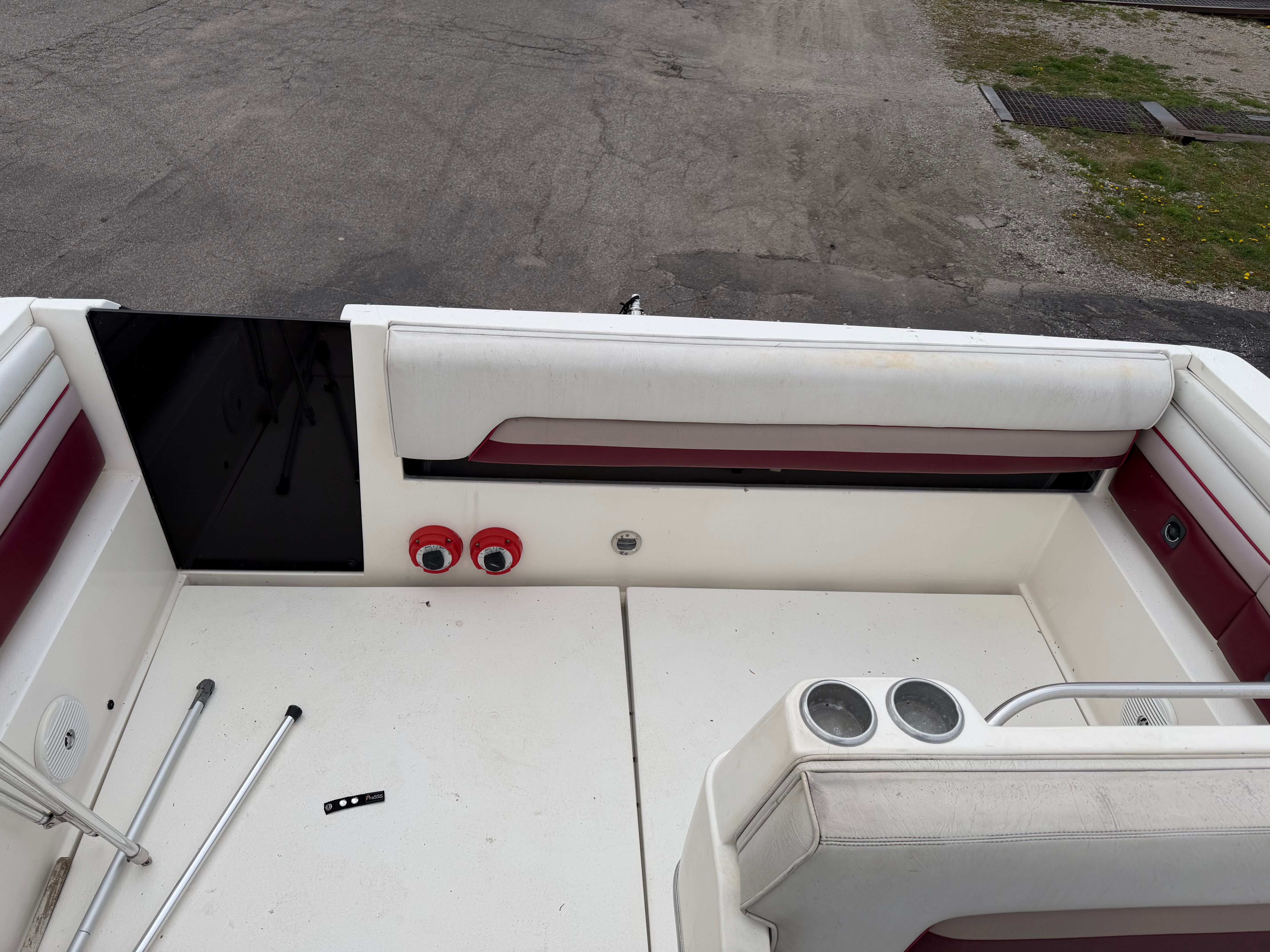 Interior of a 1990 Chaparral Signature 30 boat with red accents.