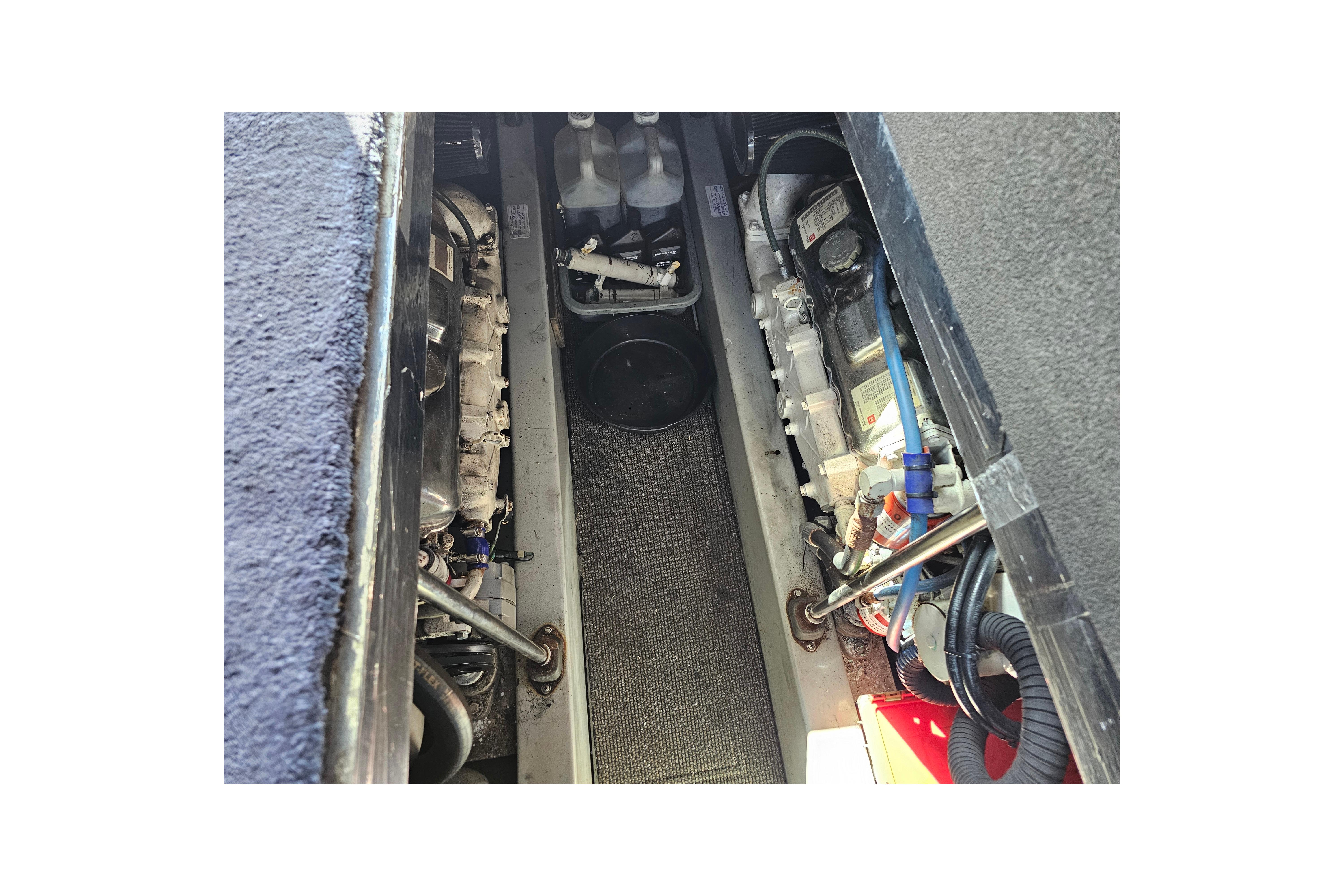 Engine compartment of a 1990 Mediterranean 38 Convertible boat, showcasing mechanical components.