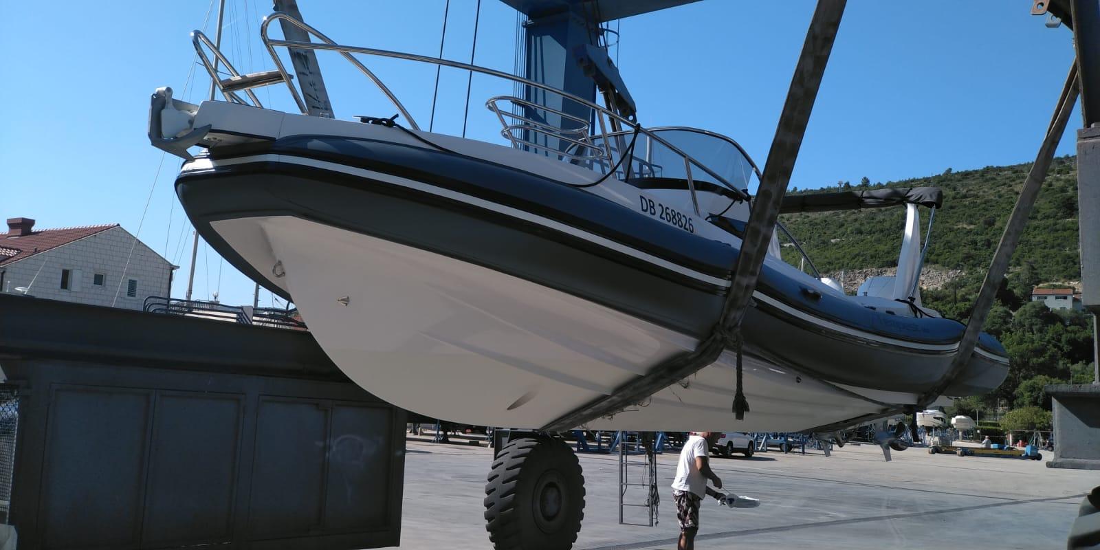 2020 Capelli Tempest 900 WA boat being lifted at a marina.