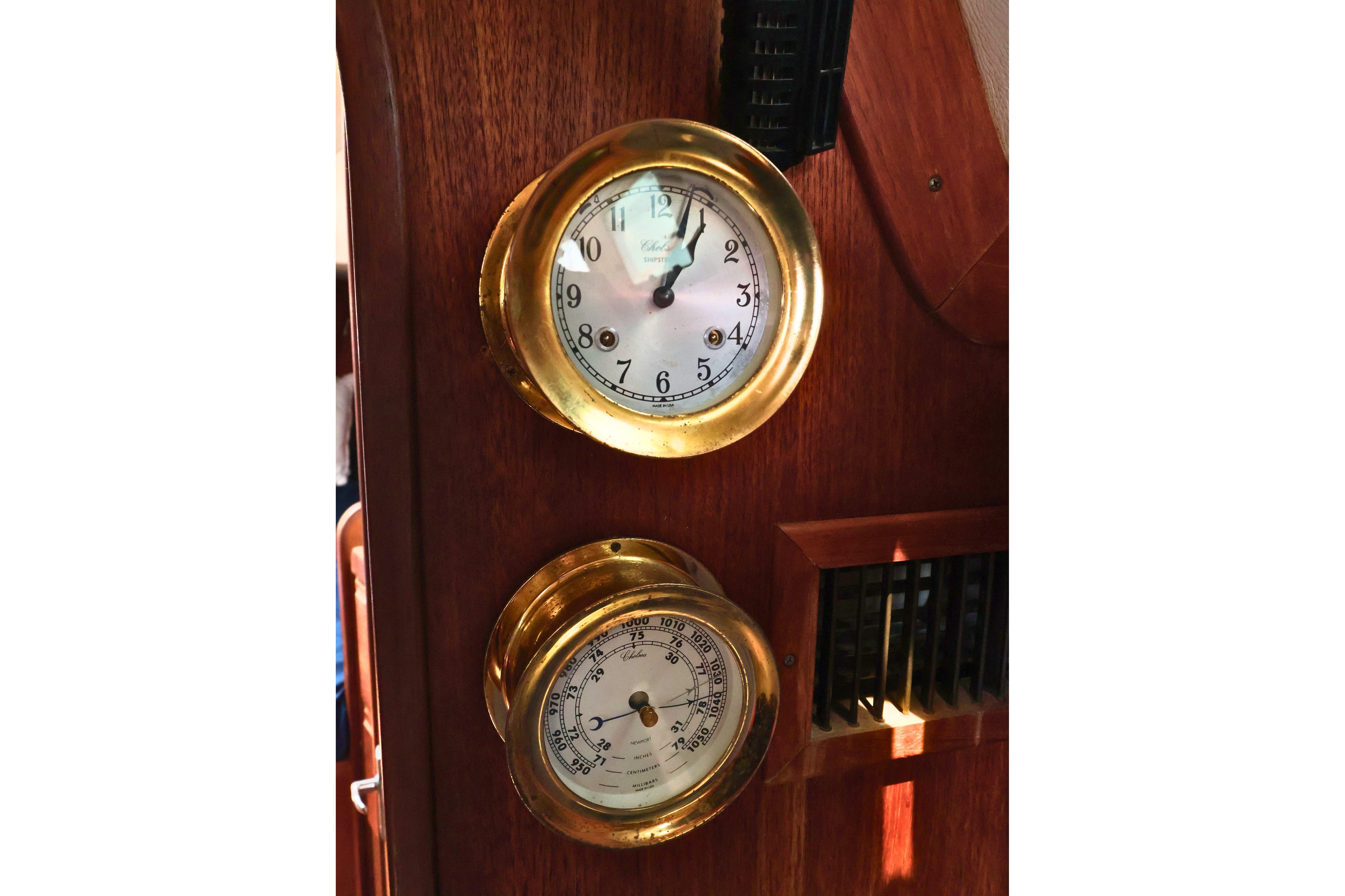 Brass clock and barometer on 1989 J Boat J 40 wooden interior.