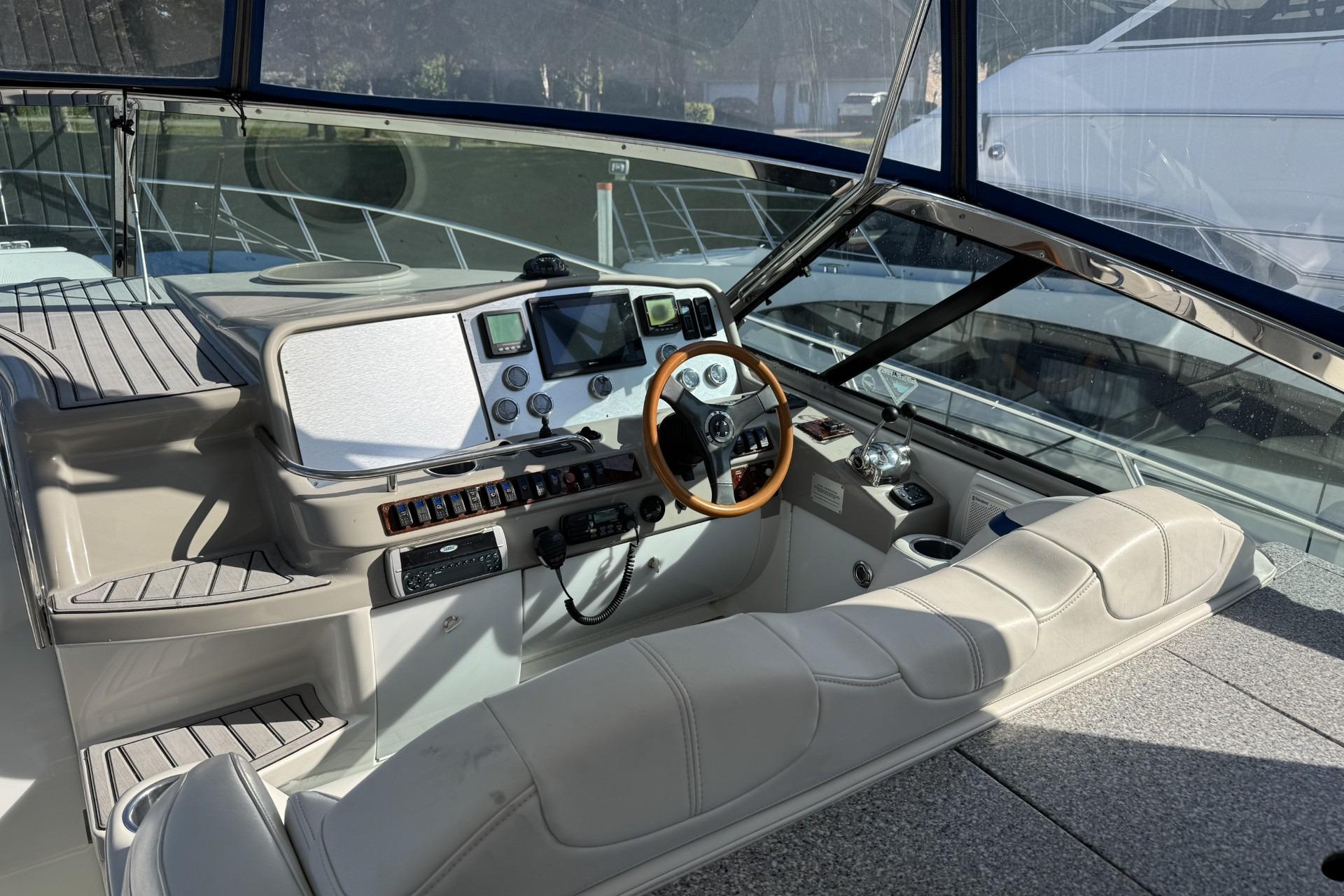 Cockpit of 2004 Formula 47 Yacht with steering wheel and navigation instruments.