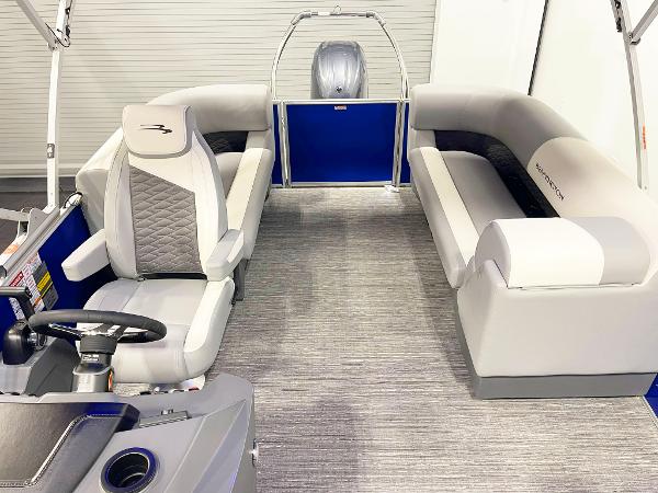 2025 Bennington 20S pontoon boat interior with gray seating and steering console.