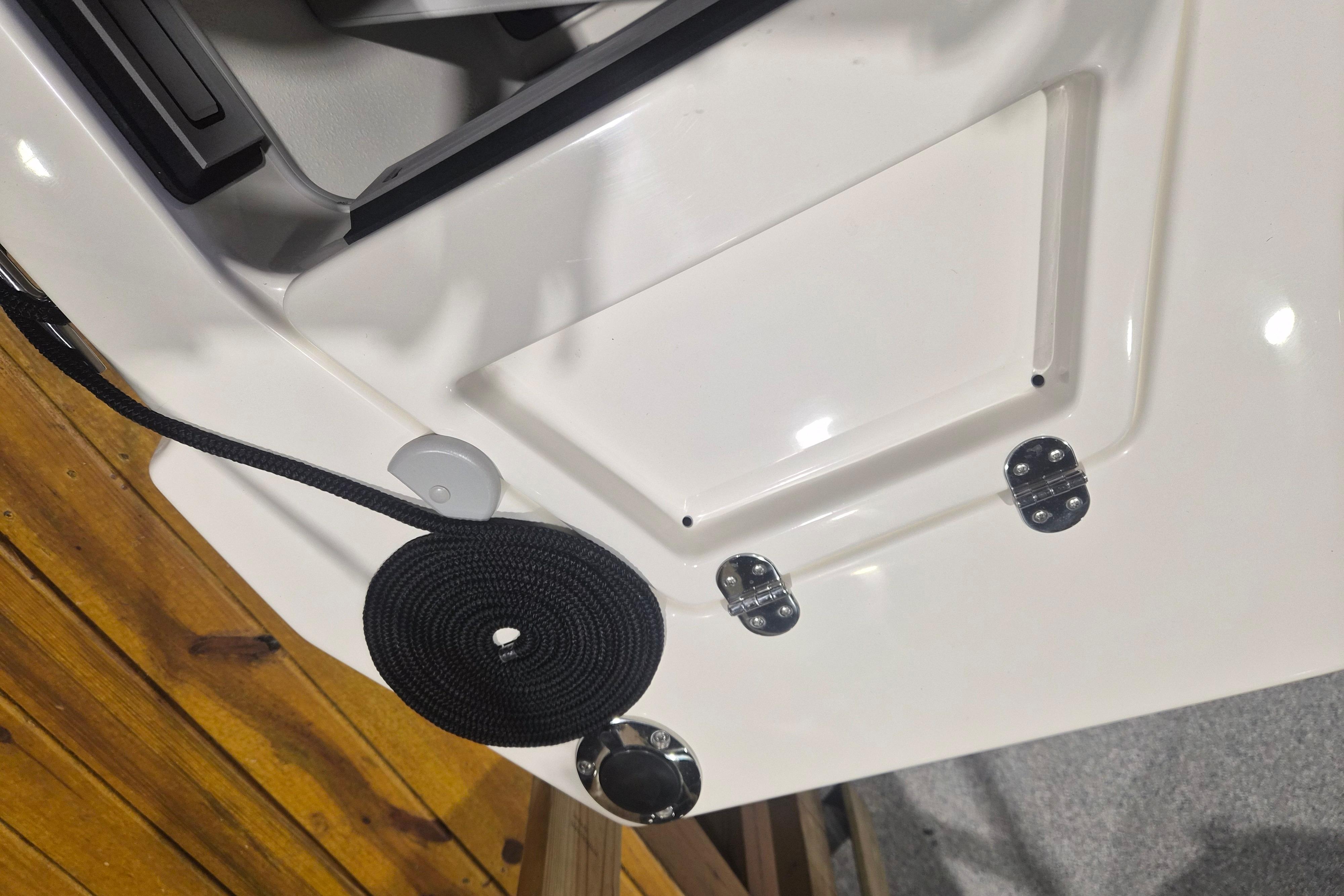 2026 Arima Sea Chaser 19 Yellowtail Edition boat deck with black rope and hatch.