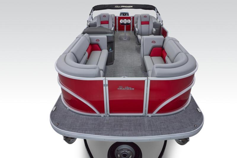 2026 Sun Tracker Party Barge 22 DLX pontoon boat with red and gray seating.