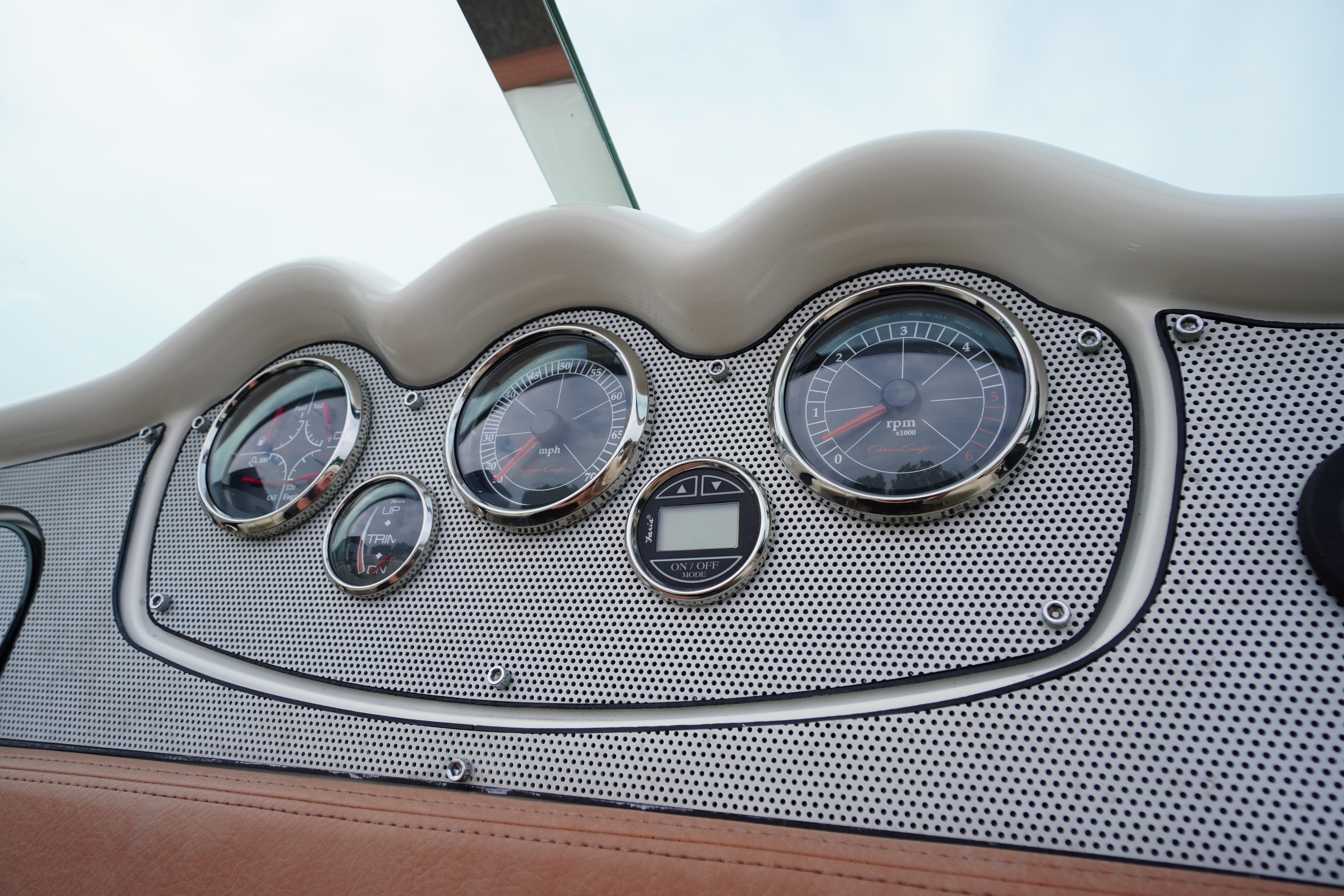 Dashboard of a 2005 Chris Craft Speedster Heritage boat with classic gauges.