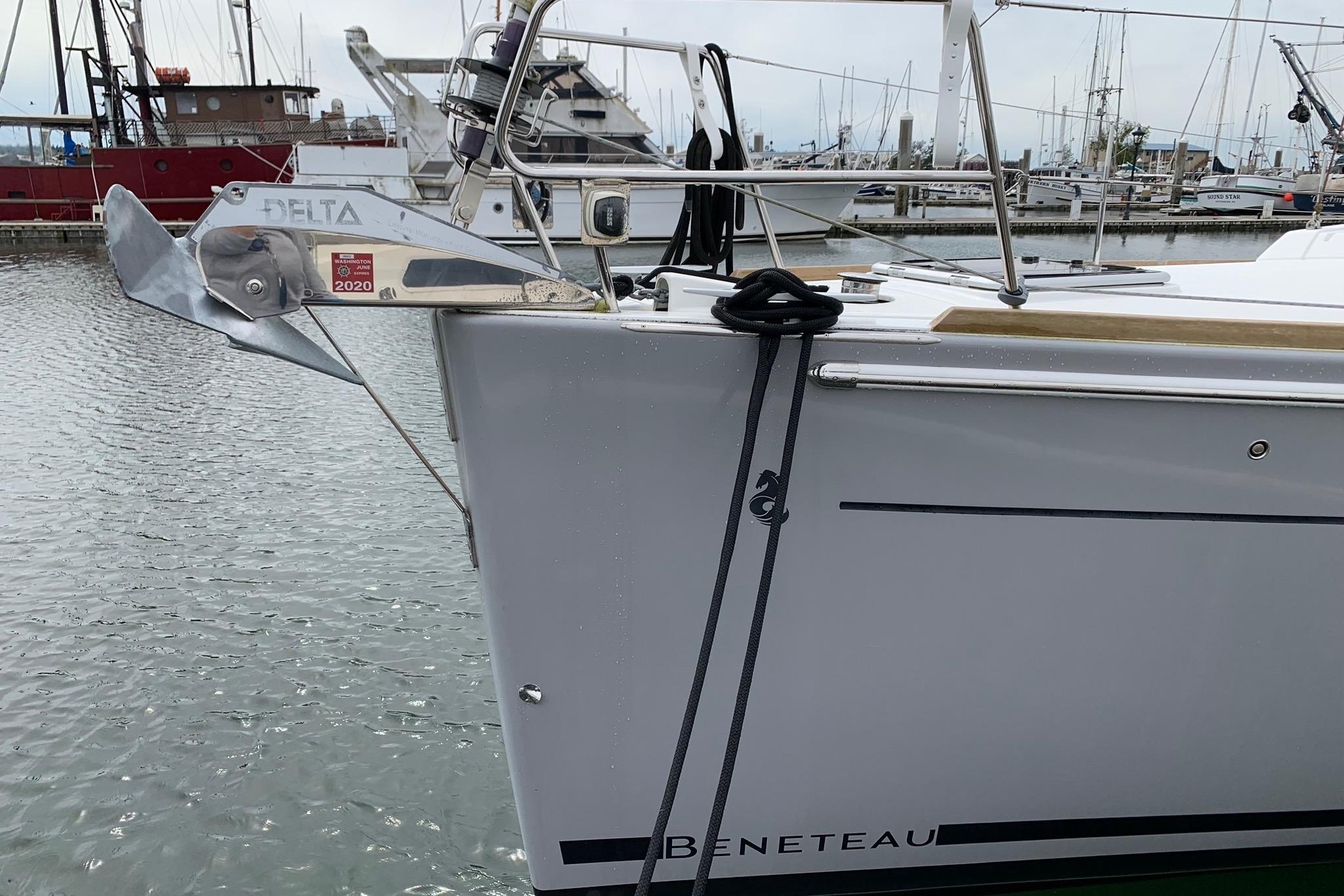Beneteau Oceanis 45 sailboat, 2018 model, docked with visible anchor and marina background.