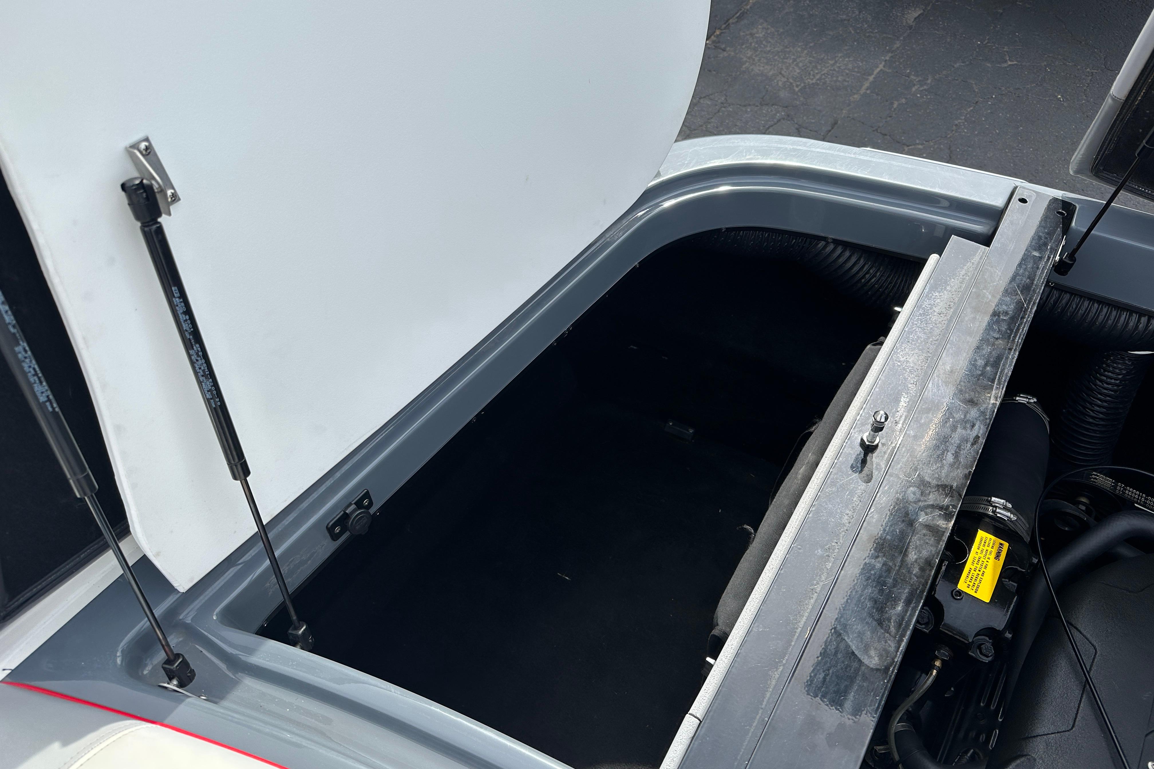 Open engine compartment of 2008 Centurion Enzo SV240 boat, showcasing interior components.