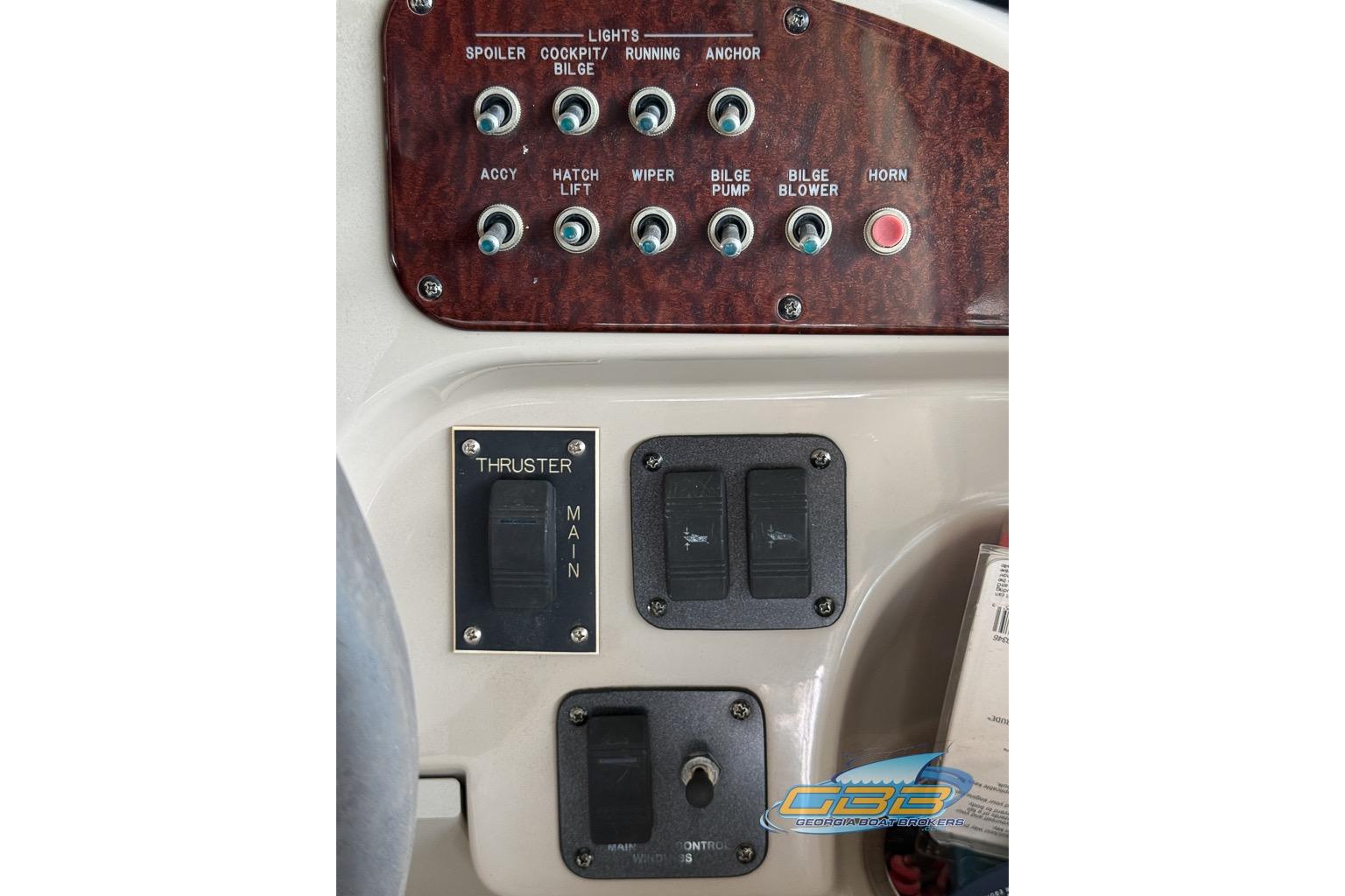 Control panel of a 2006 Sea Ray Sundancer 260 boat with labeled switches.