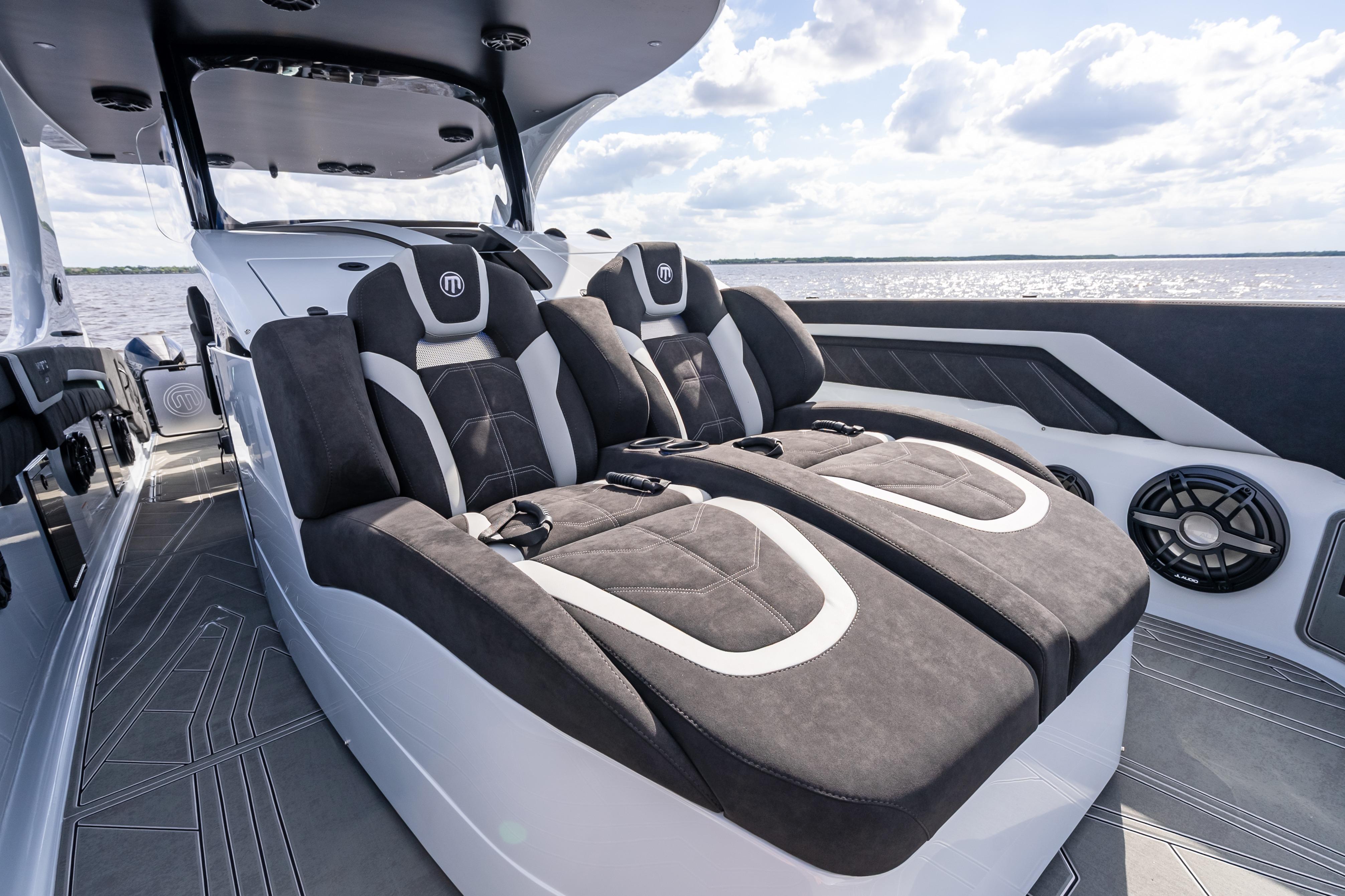 2027 Mystic Powerboats M4200 interior with luxurious seating and modern design on open water.