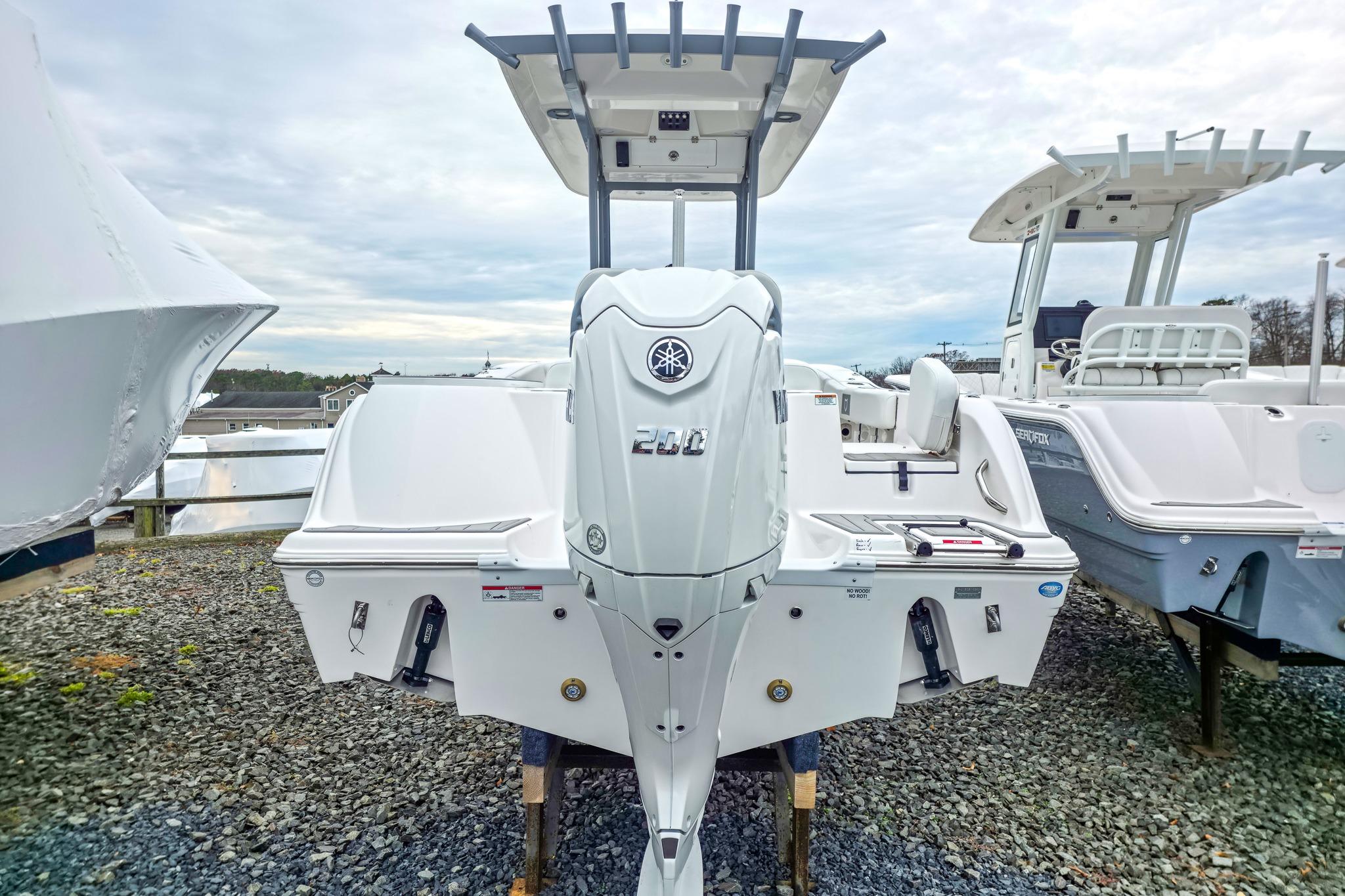 2026 Sea Fox 228 Commander boat with Yamaha engine, displayed outdoors.