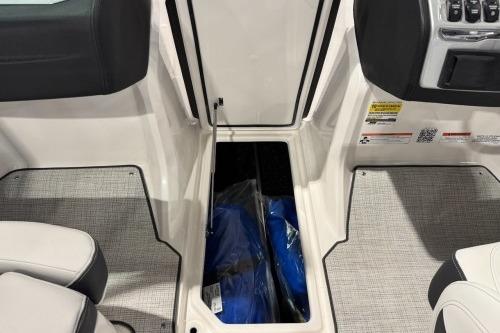 2026 Regal 21 OBX boat interior storage compartment with blue items inside.