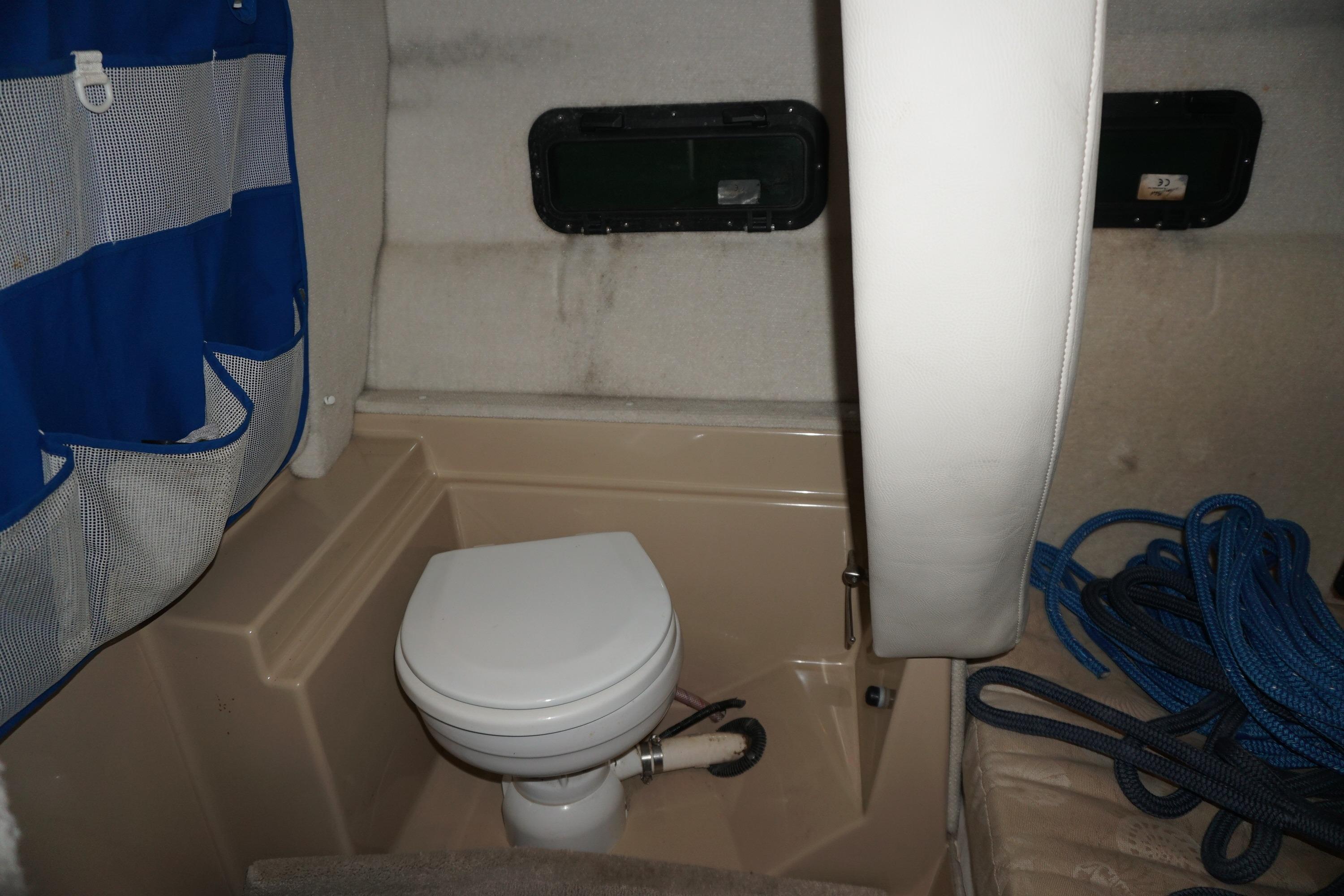 2013 Ranger Tugs S-31 boat interior with toilet and storage area.