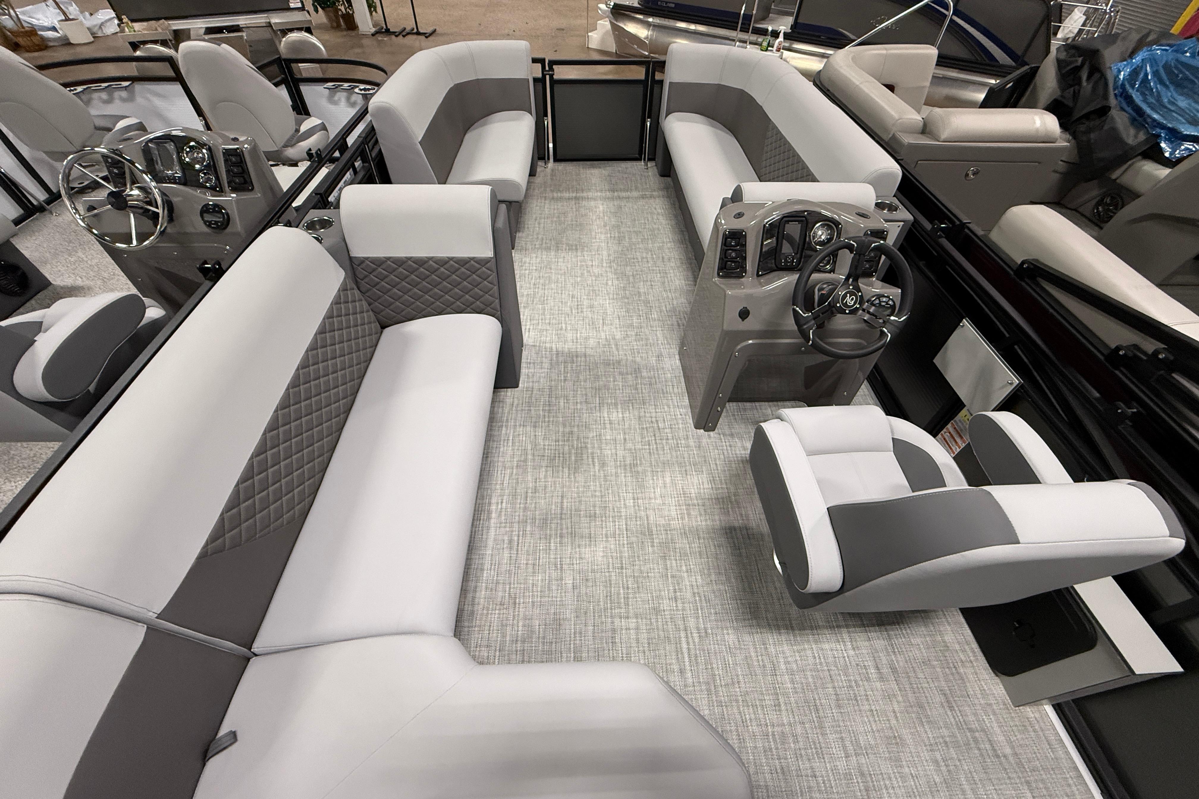 2026 Angler Quest 818 Panfish Cruise interior with modern seating and steering console.