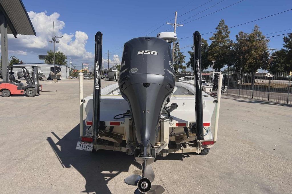 1997 Gravois 20CC boat with Yamaha 250 outboard motor in a parking lot.