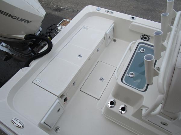 2024 Ranger 2360 Bay boat deck with storage compartments and Mercury outboard motor.
