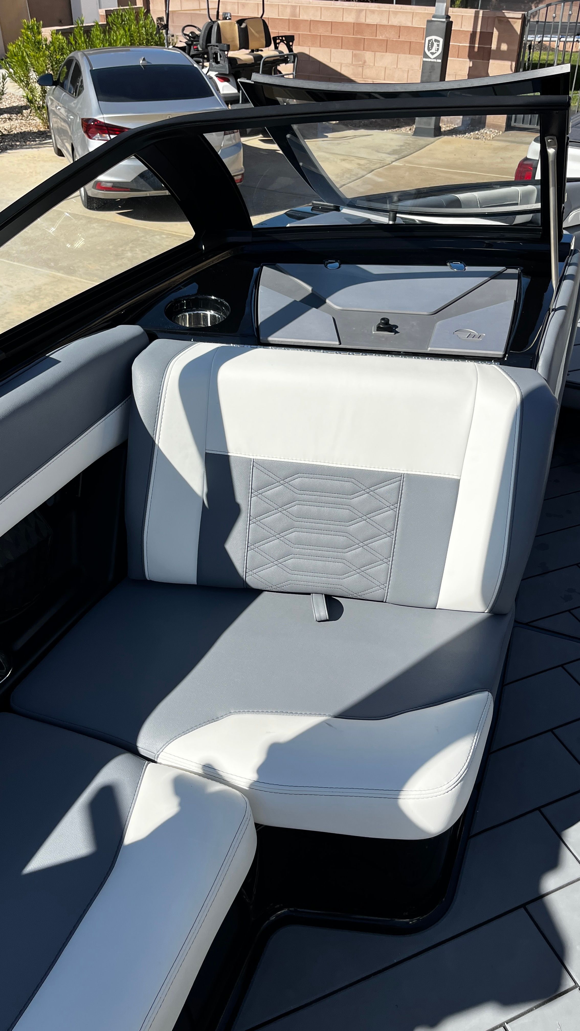 Interior of a Malibu Wakesetter 26 LSV with gray and white seating.